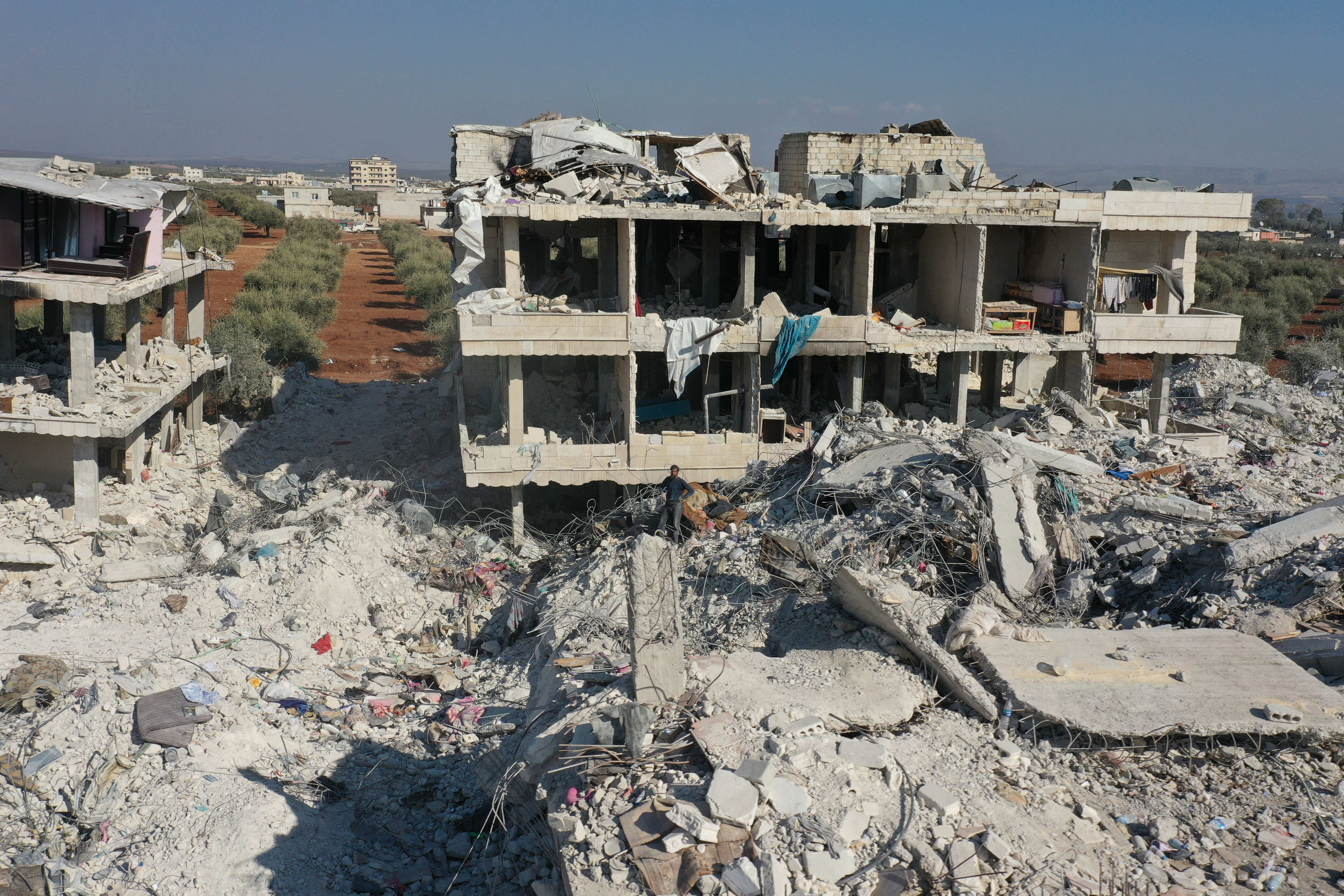 An aerial view shows the rubble of collapsed and semi-collapsed buildings in the Syrian rebel-held town of Jindayris on February 15, 2023