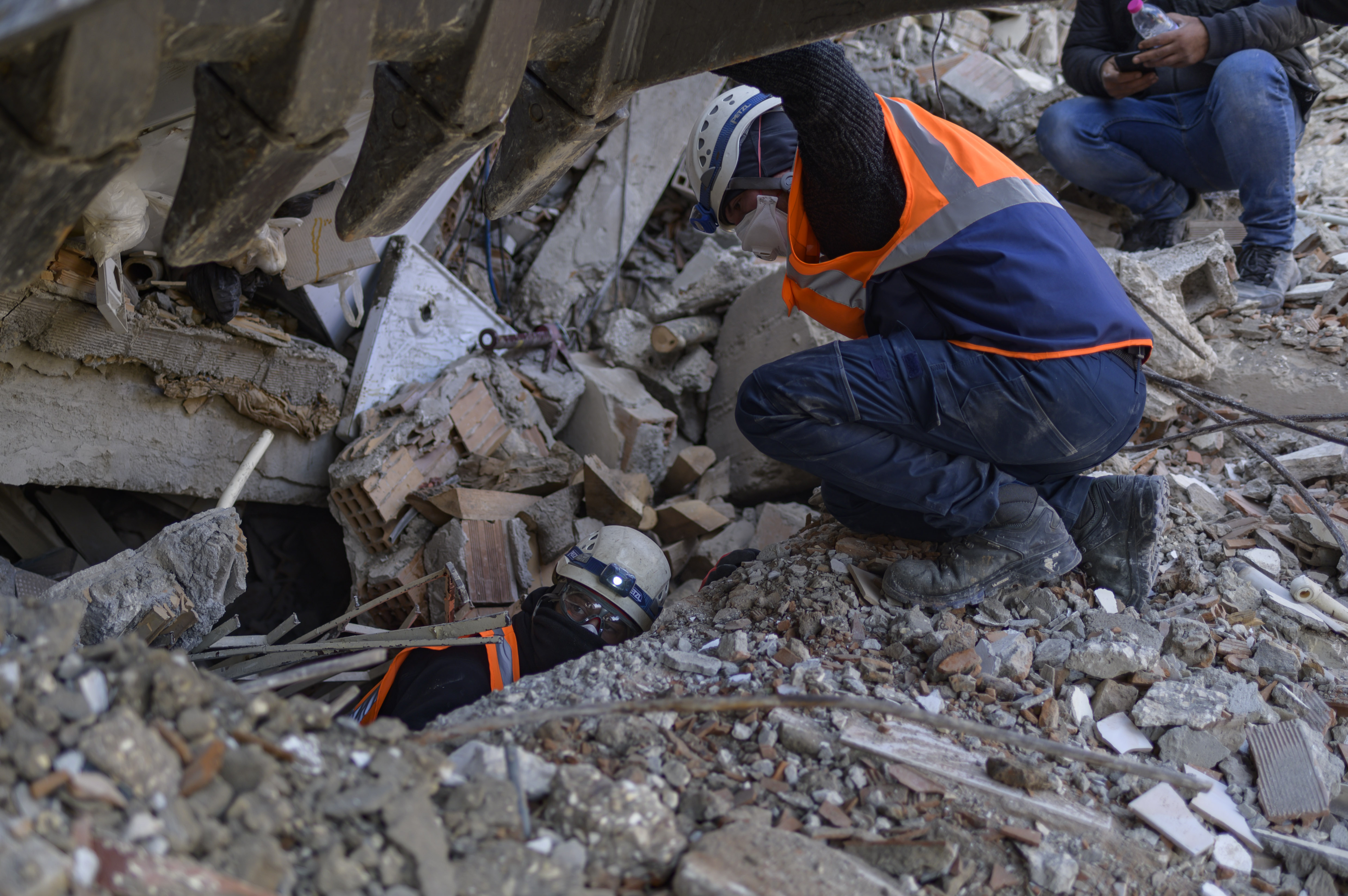 Greek and Turkish rescuers are at work to extract bodies of victims from the rubble of a collapsed building in Antakya, Hatay province in Turkey.