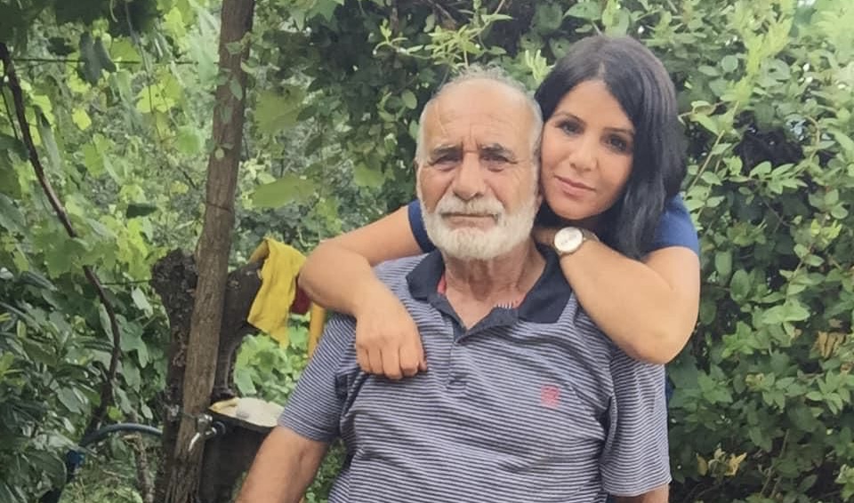 Ayse Arslan and her father in the garden of their family home in Armagan village in Trabzon, Turkey