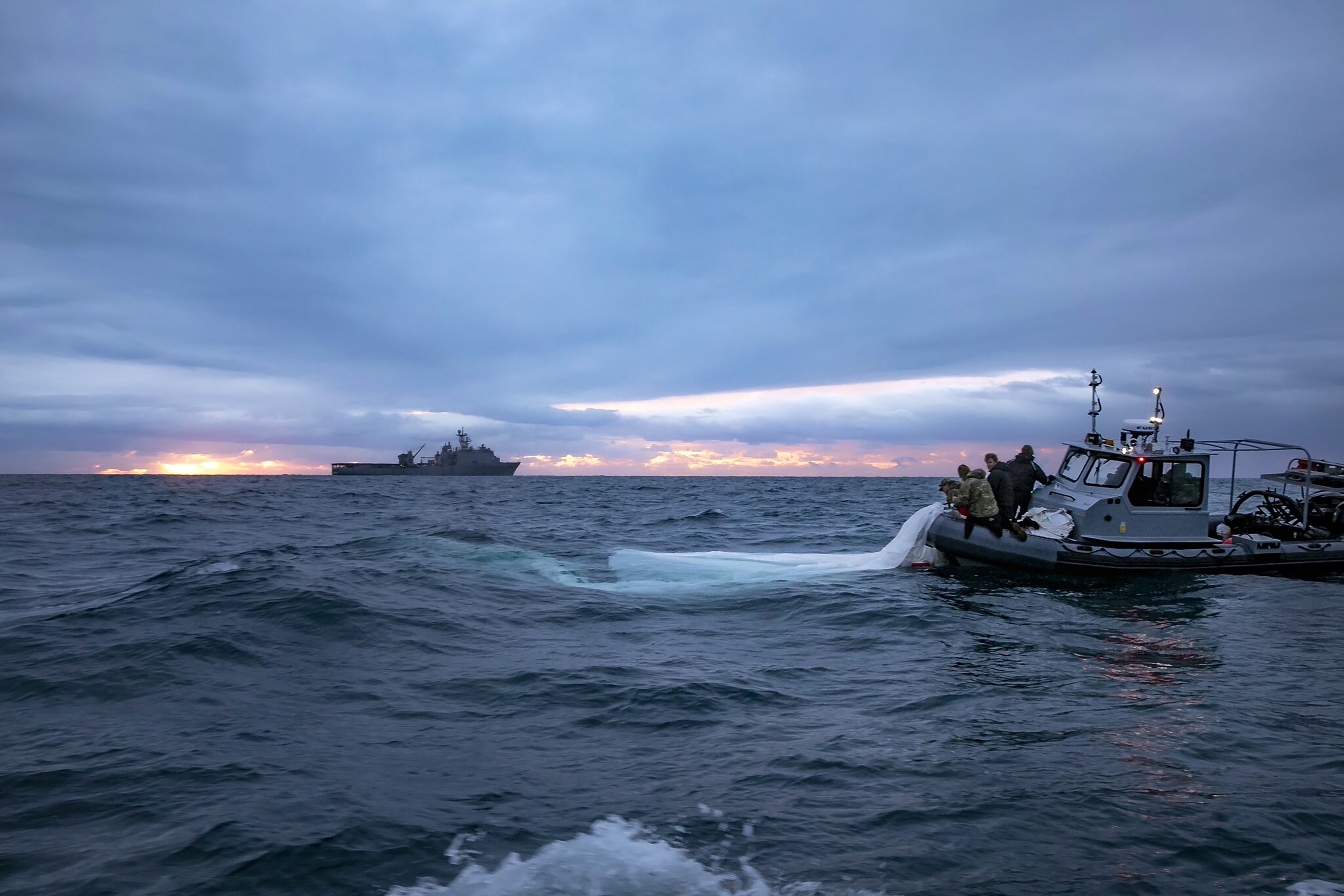US Navy image of operation to recover Chinese balloon shot down off US coast