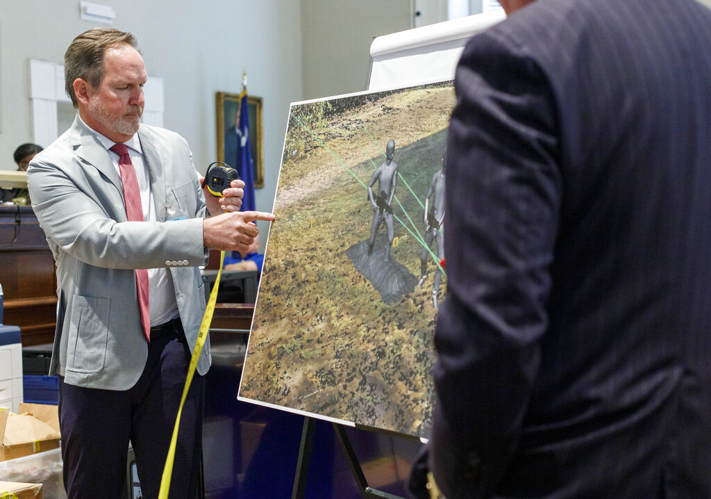 A forensic engineer shows a recreation of the crime scene