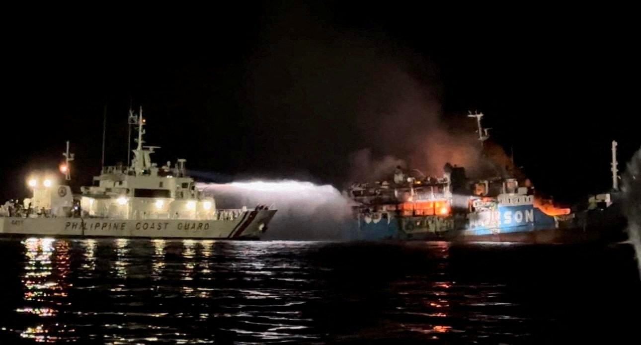 Philippine Coast Guard respond to the fire incident onboard M/V LADY MARY JOY 3 at the waters off Baluk-Baluk Island, Hadji Muhtamad, Basilan, Philippines, March 29, 2023. Philippine Coast Guard/Handout via REUTERS THIS IMAGE HAS BEEN SUPPLIED BY A THIRD PARTY. NO RESALES. NO ARCHIVES.