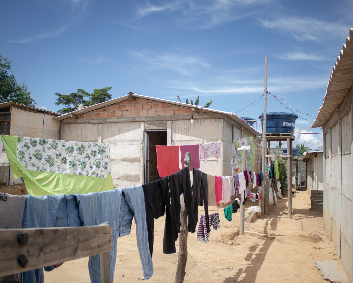 Laundry hangs to dry in the occupation, bringing colour to the surroundings