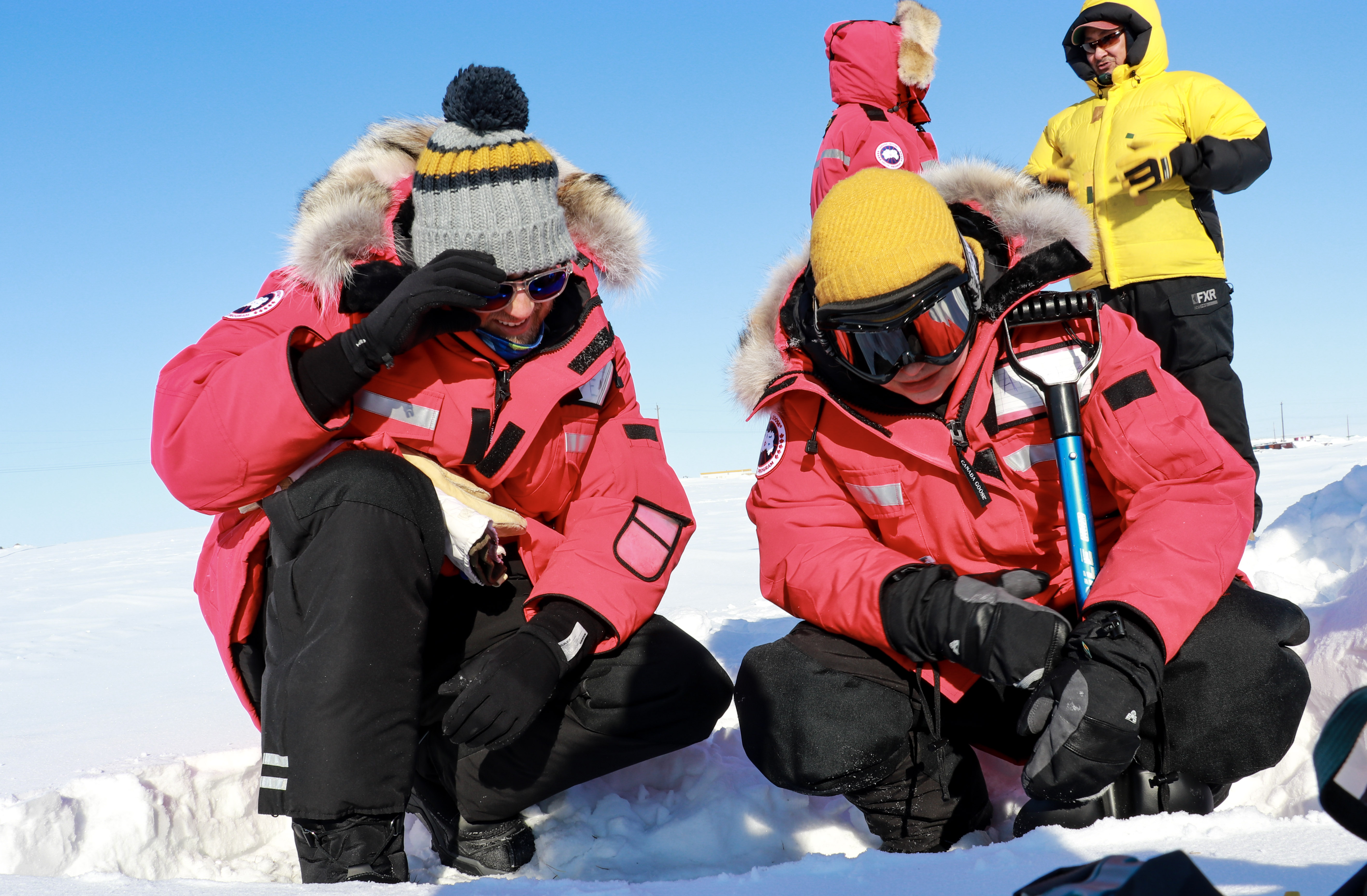 Snow school participants conducting field work