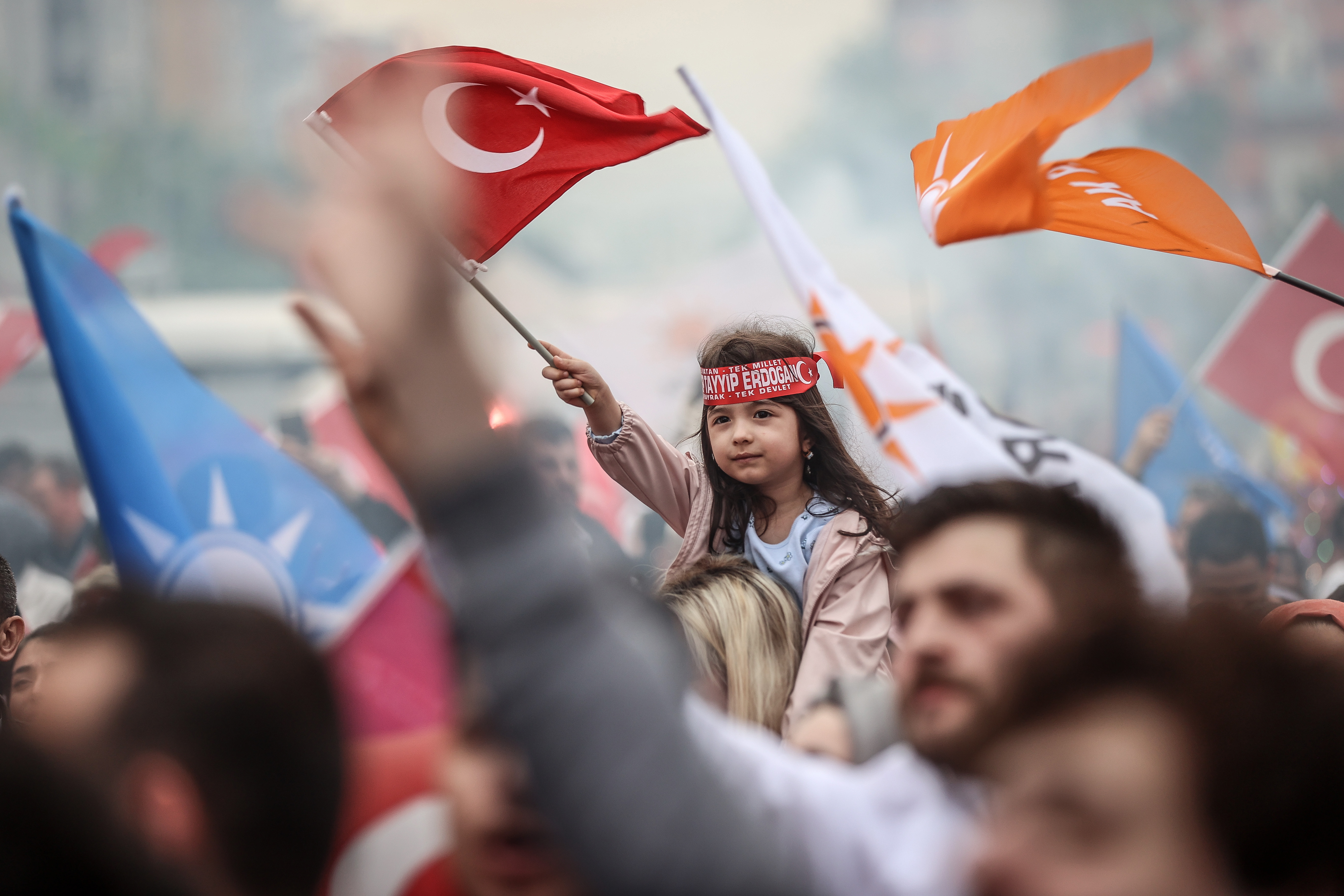 Citizens supporting Justice and Development (AK) Party celebrate after voting in the country's presidential runoff