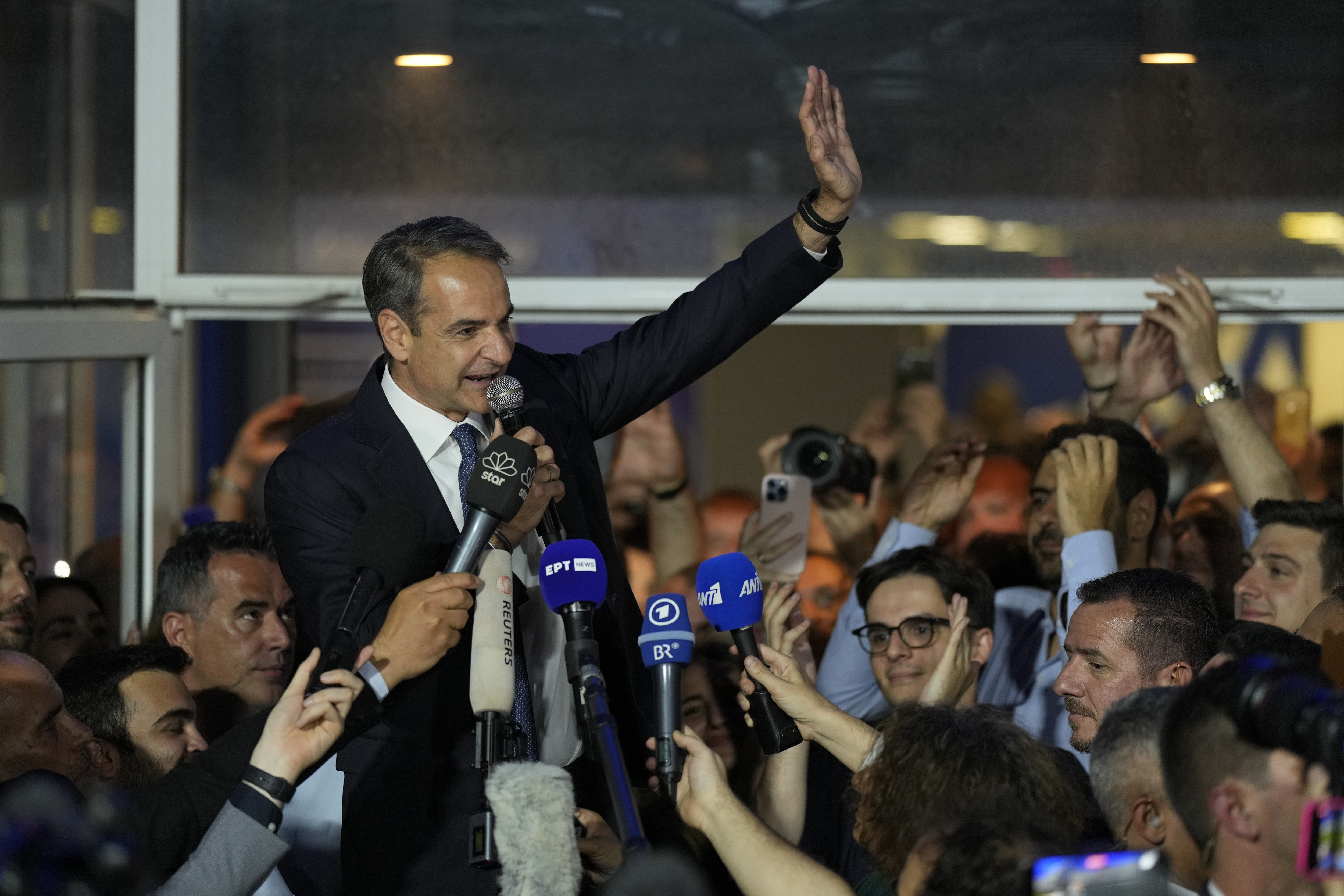 Prime Minister Kyriakos Mitsotakis addresses supporters at the New Democracy headquarters in Athens, Greece