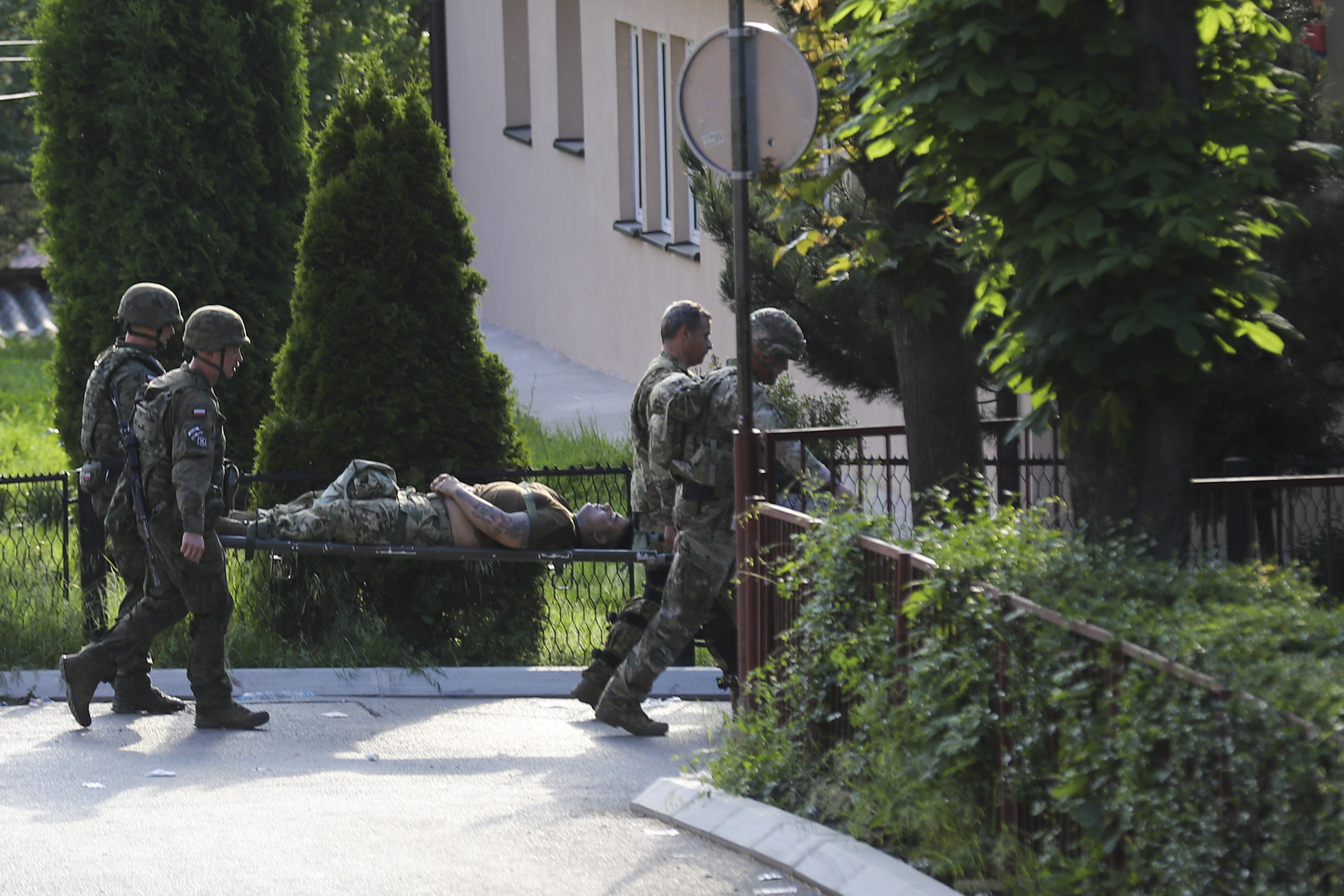 A KFOR soldier is carried on a stretcher after suffering an injury during clashes with Kosovo Serbs in the town of Zvecan, northern Kosovo