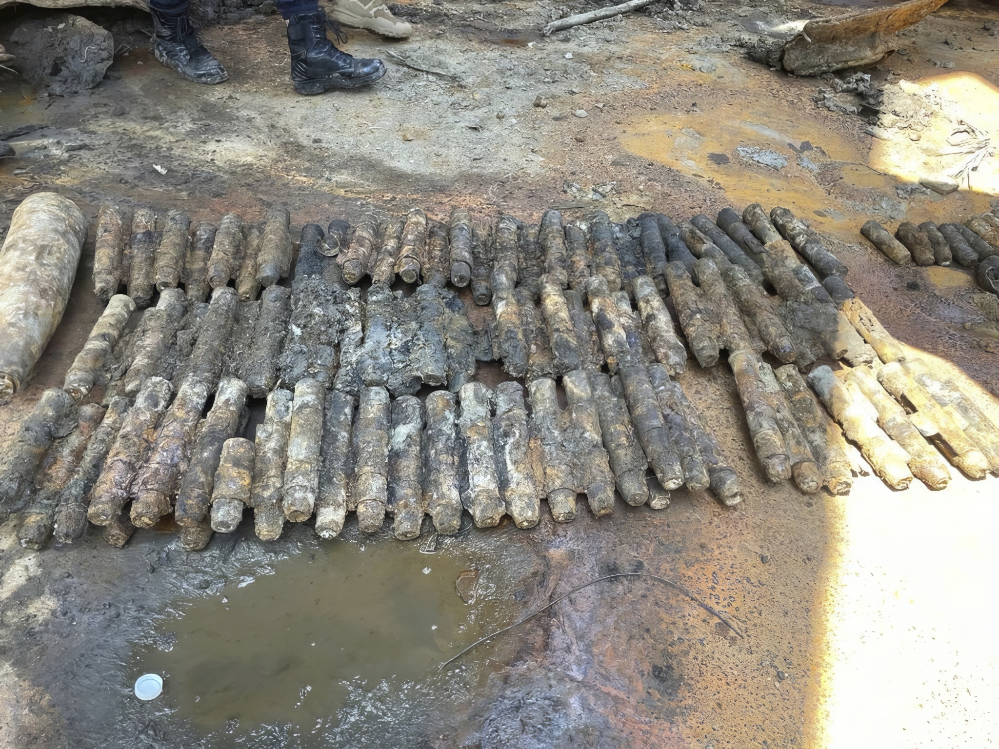 Malaysian authorities found some 100 artillery shells thought to be more than 80 years old [Malaysian Maritime Enforcement Agency via AP Photo