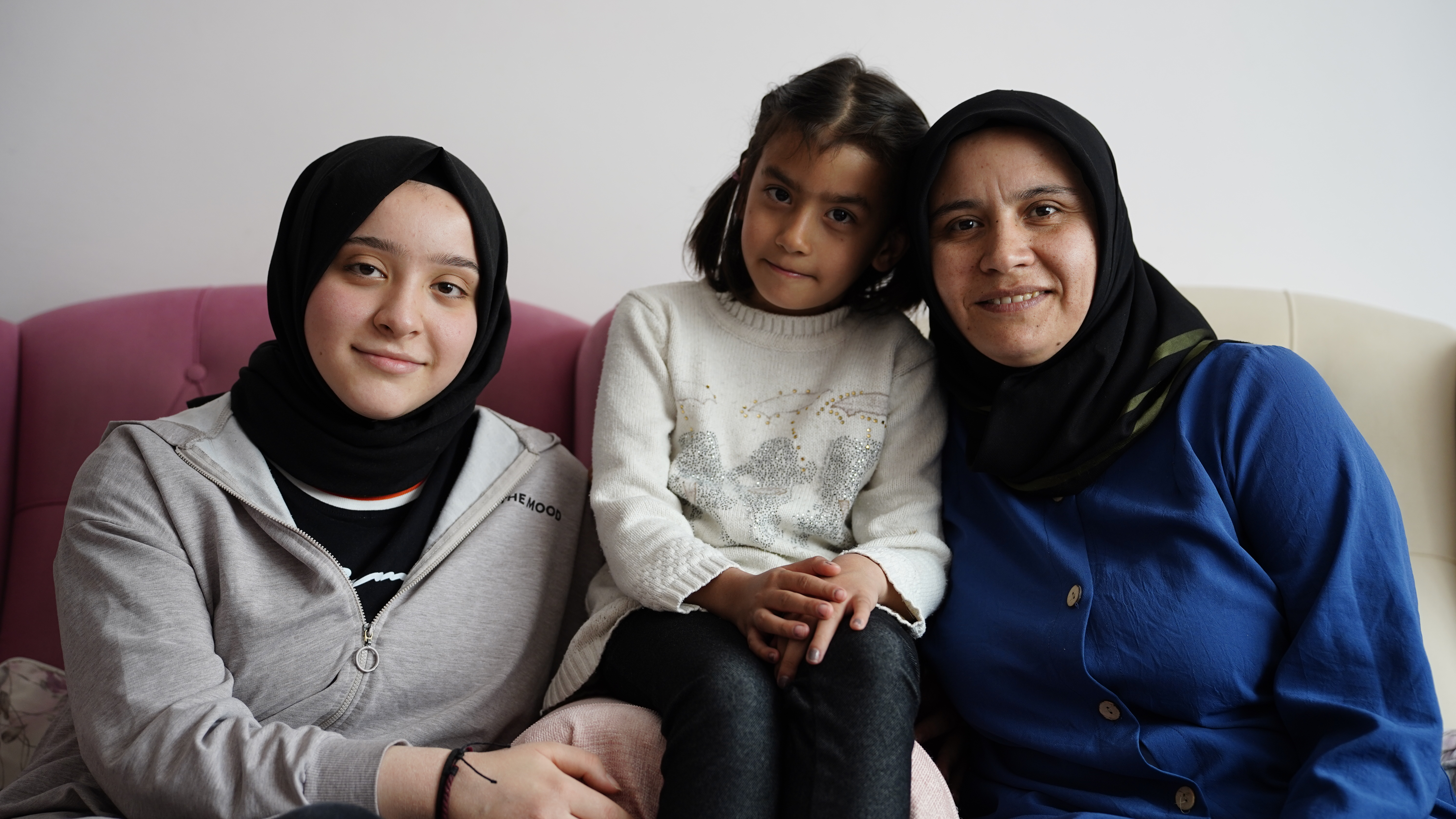 A woman with her two daughters