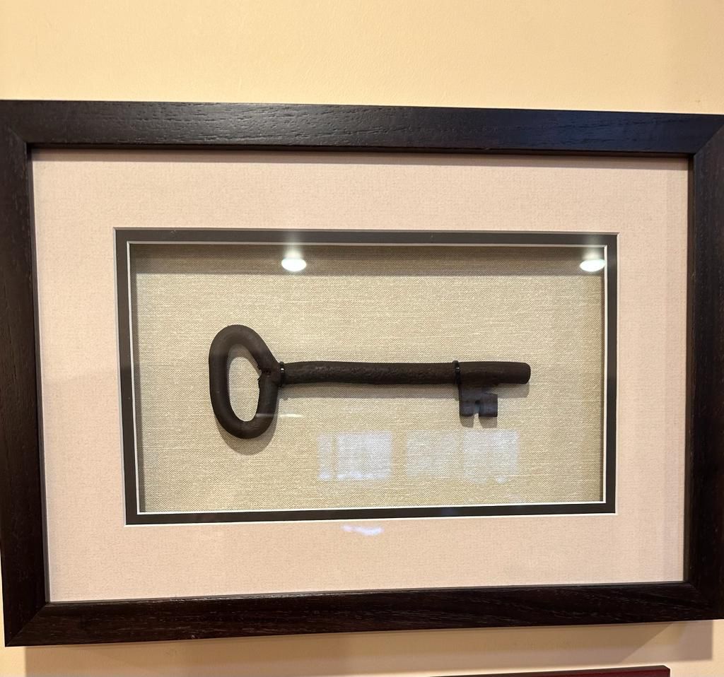 The key to Leila Giries’s house in Ayn Karim is now framed in her Los Angeles home [Courtesy of Leila Giries]