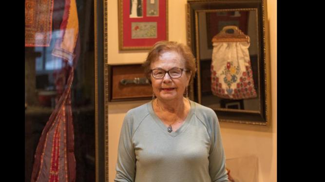 Leila Giries in her home in Los Angeles on May 11, 2023, with family belongings from her village of Ayn Karim [Leila Giries]