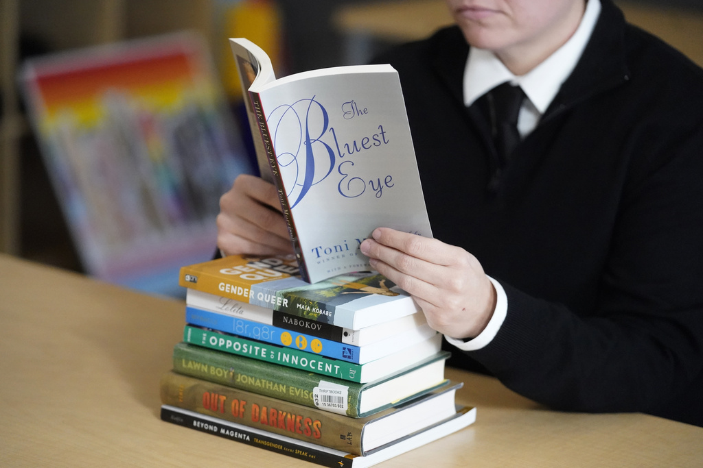 A student reads a library book