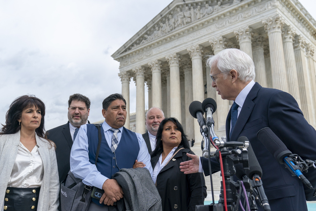 The family of a student killed in an ISIL attack stand in front of the US Supreme Court