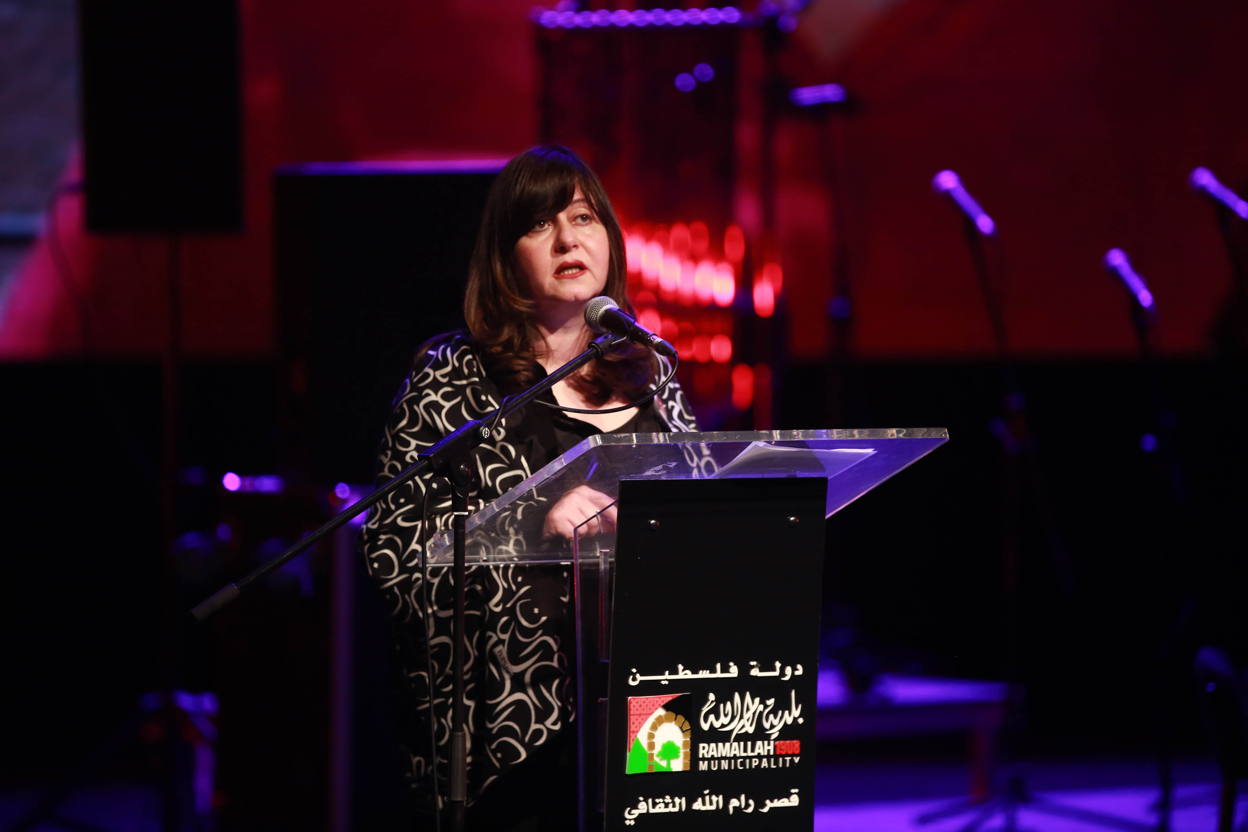 Iman Hammouri, director of the PAC, speaking at the memorial event [Al Jazeera]