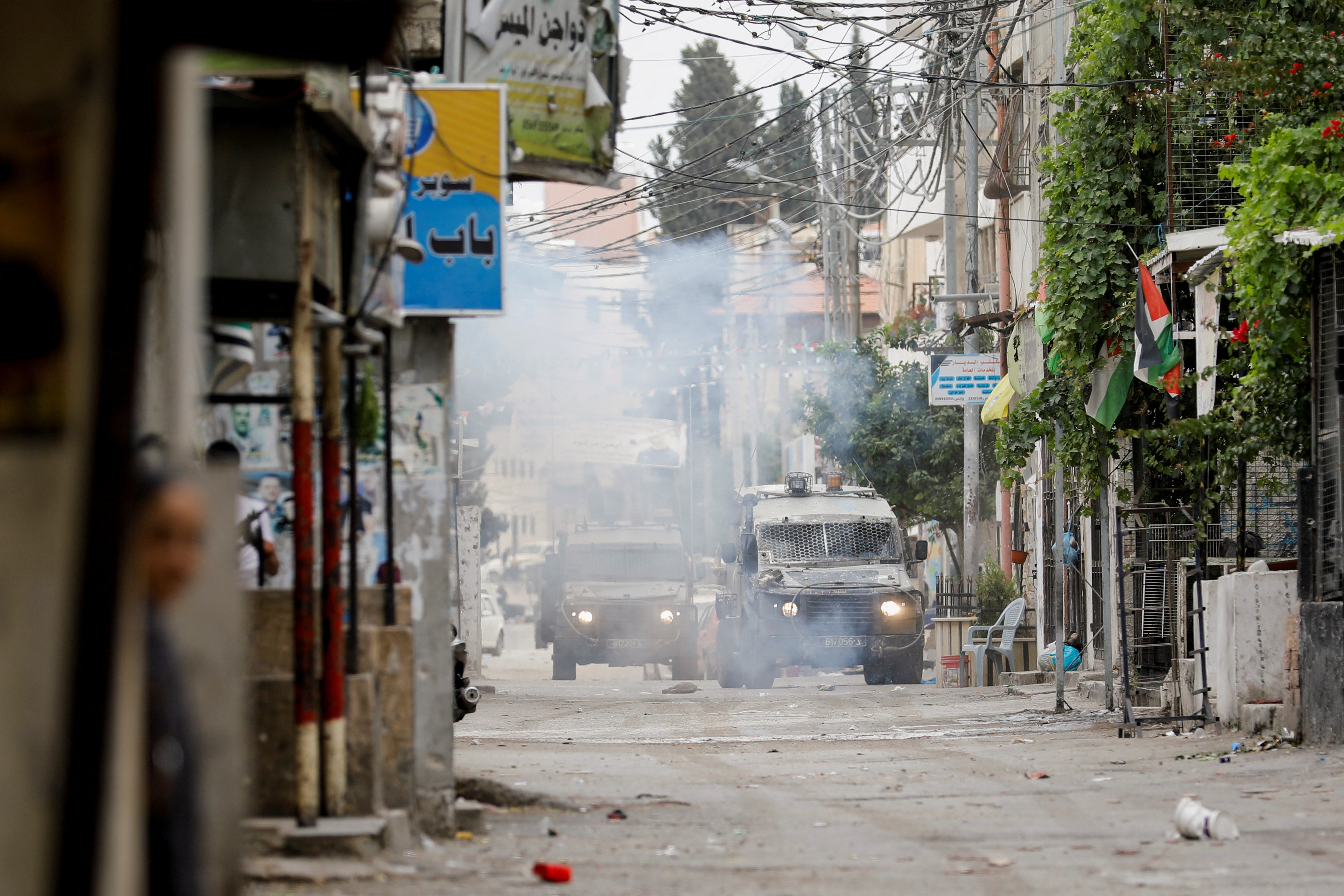 Military vehicles are seen during an Israeli raid in Nablus in the Israeli-occupied West Bank