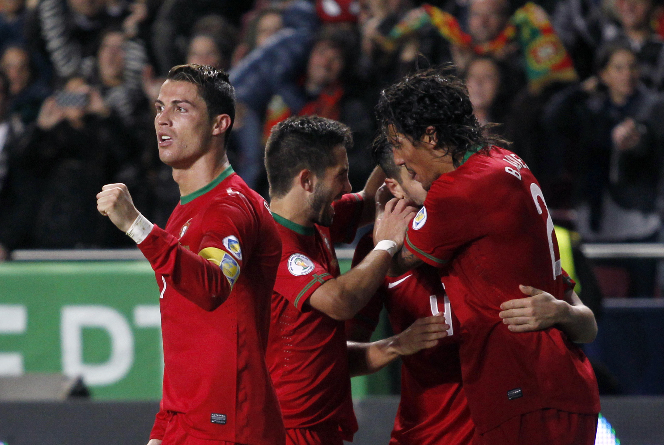 Ronaldo, left, celebrates after scoring the opening goal against Sweden in Lisbon, 2013