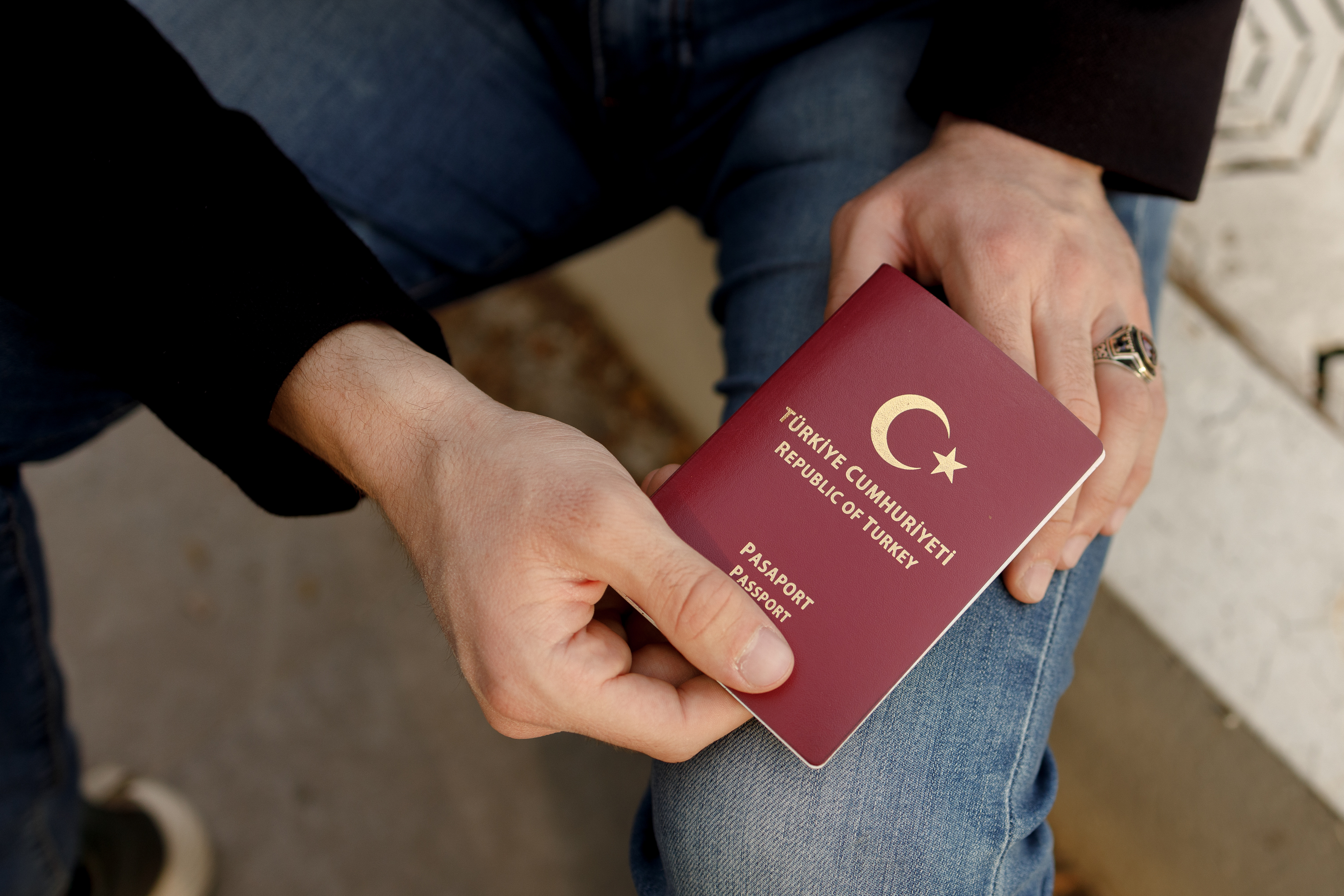 Hatim al-Abdullah shows his Turkish passport