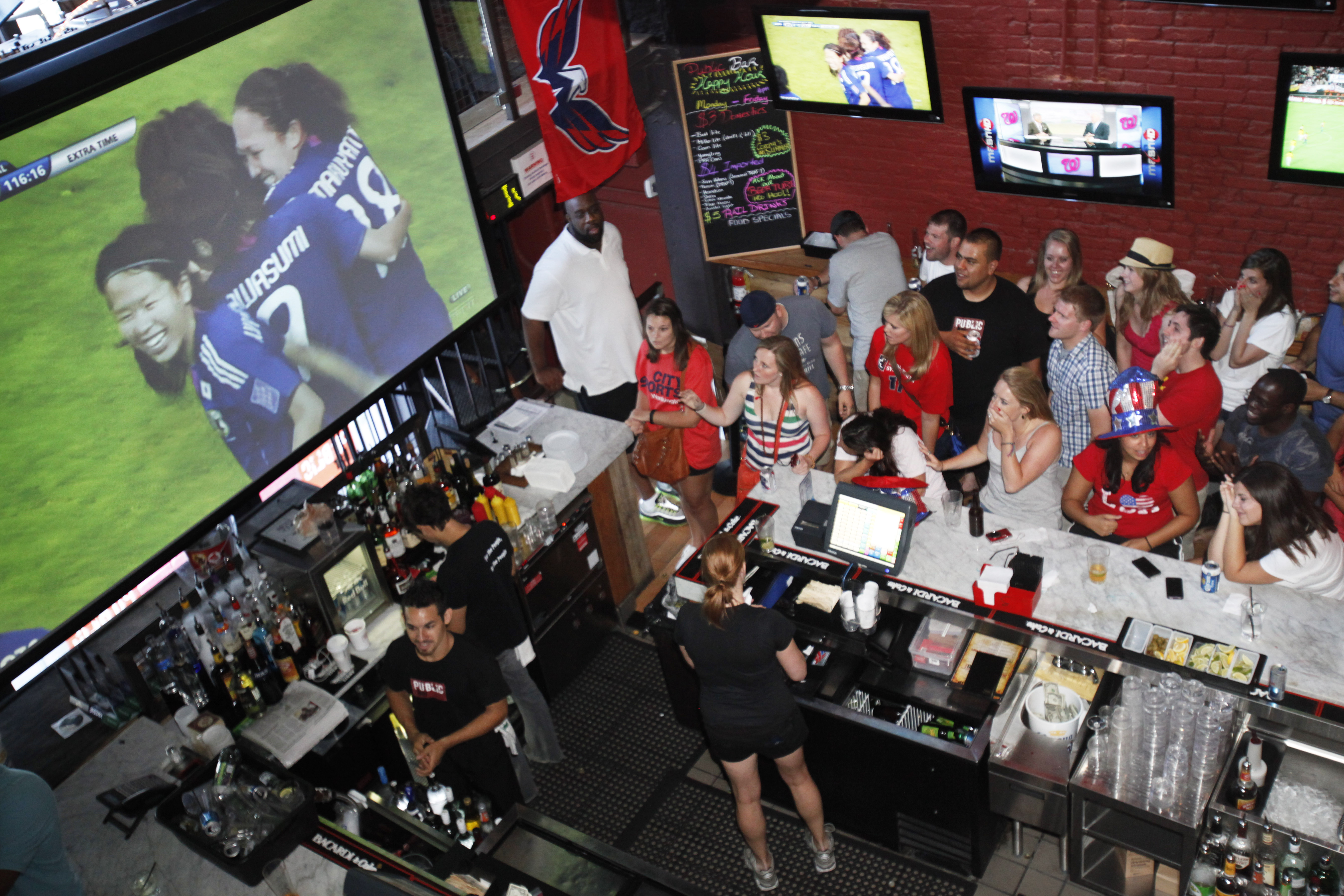 US fans react as Japan scores during extra time of the Women’s World Cup football final in 2011