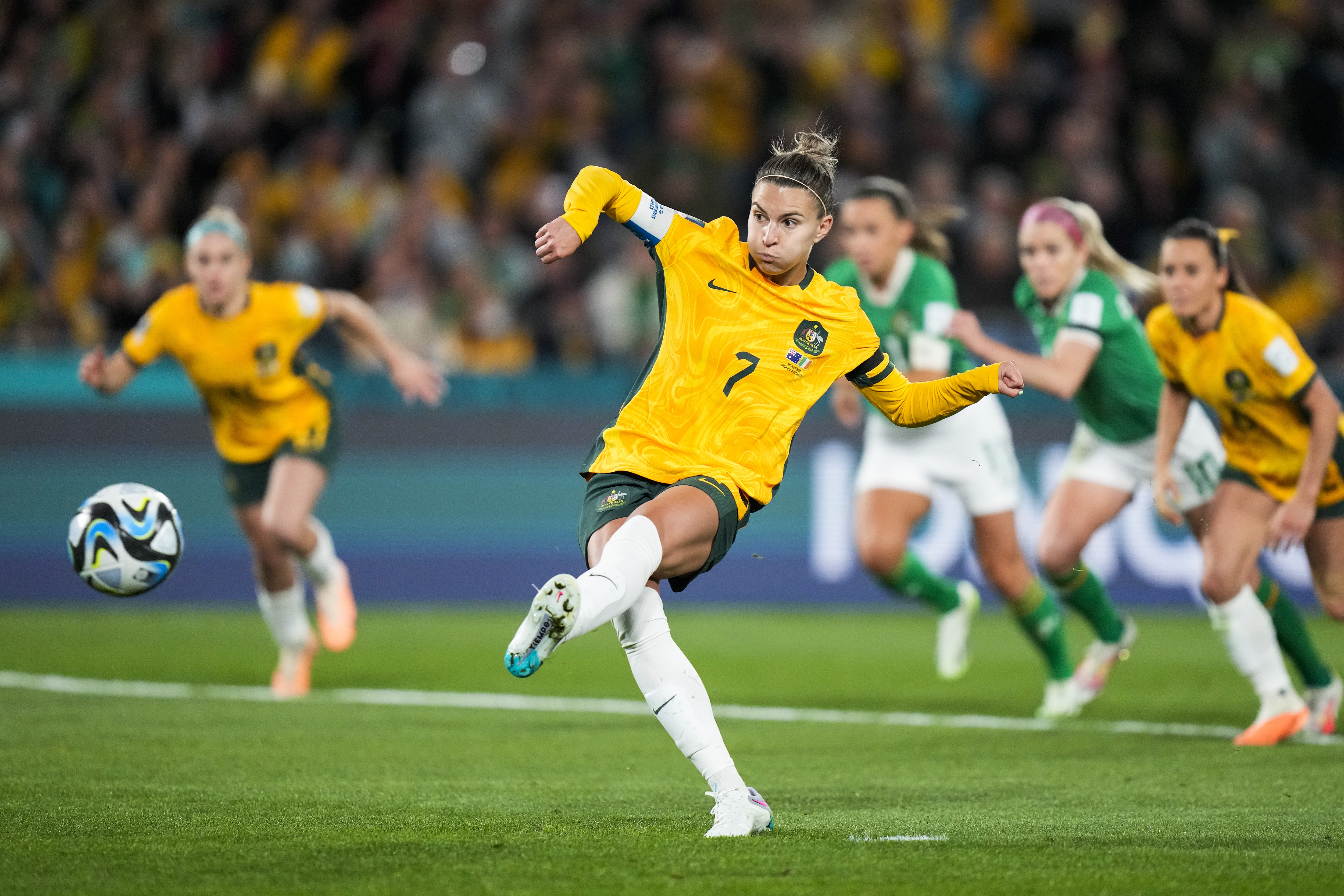 Australia's Steph Catley shoots a penalty kick to score the opening goal