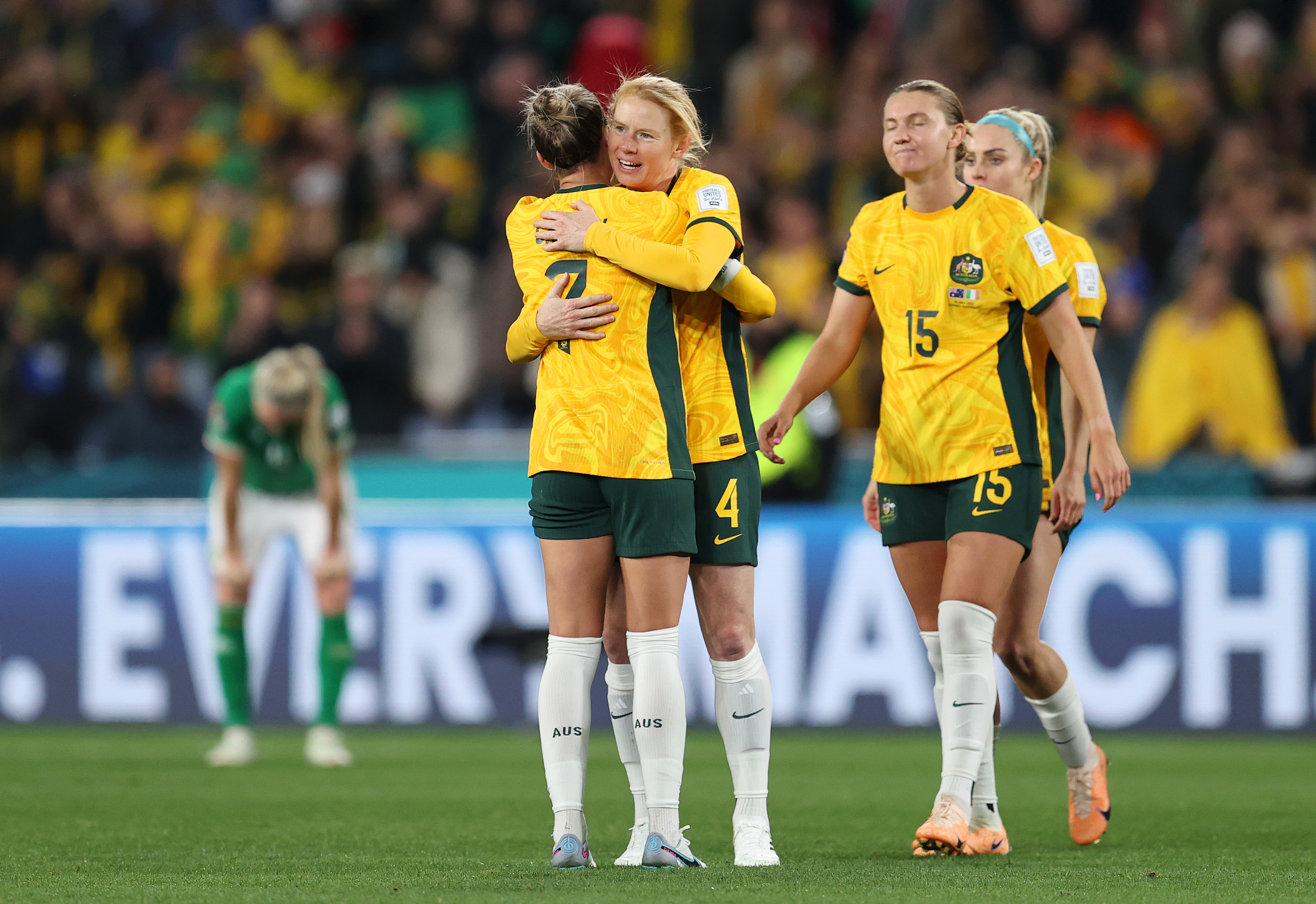 Steph Catley, left, celebrates the 1-0 victory with other Australian players