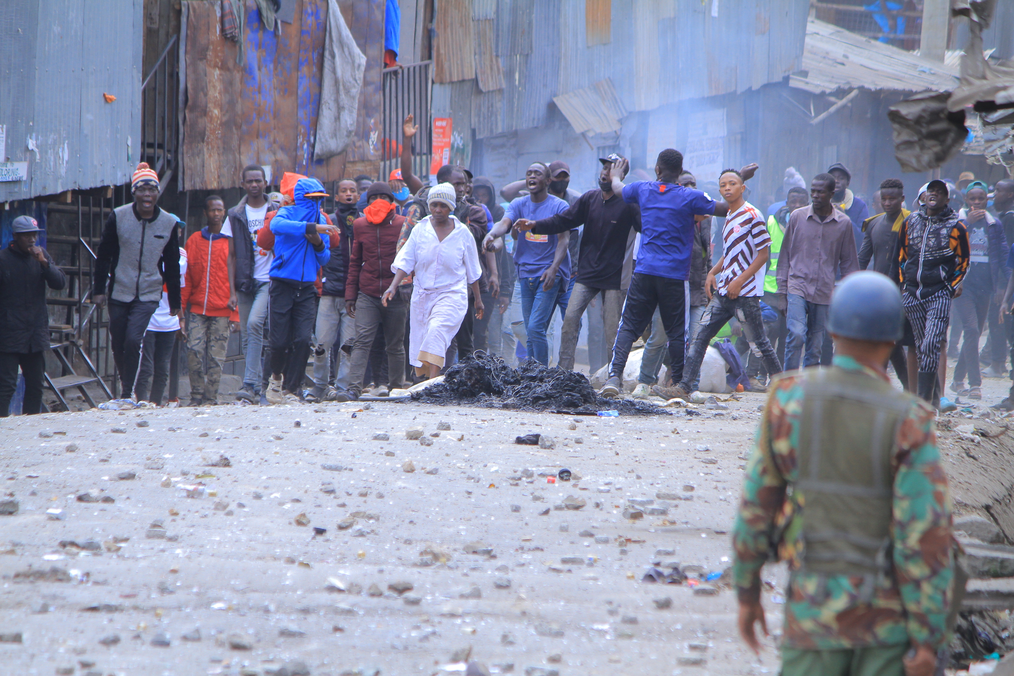 A group of protesters charge towards the police in Mathare, Nairobi Kenya