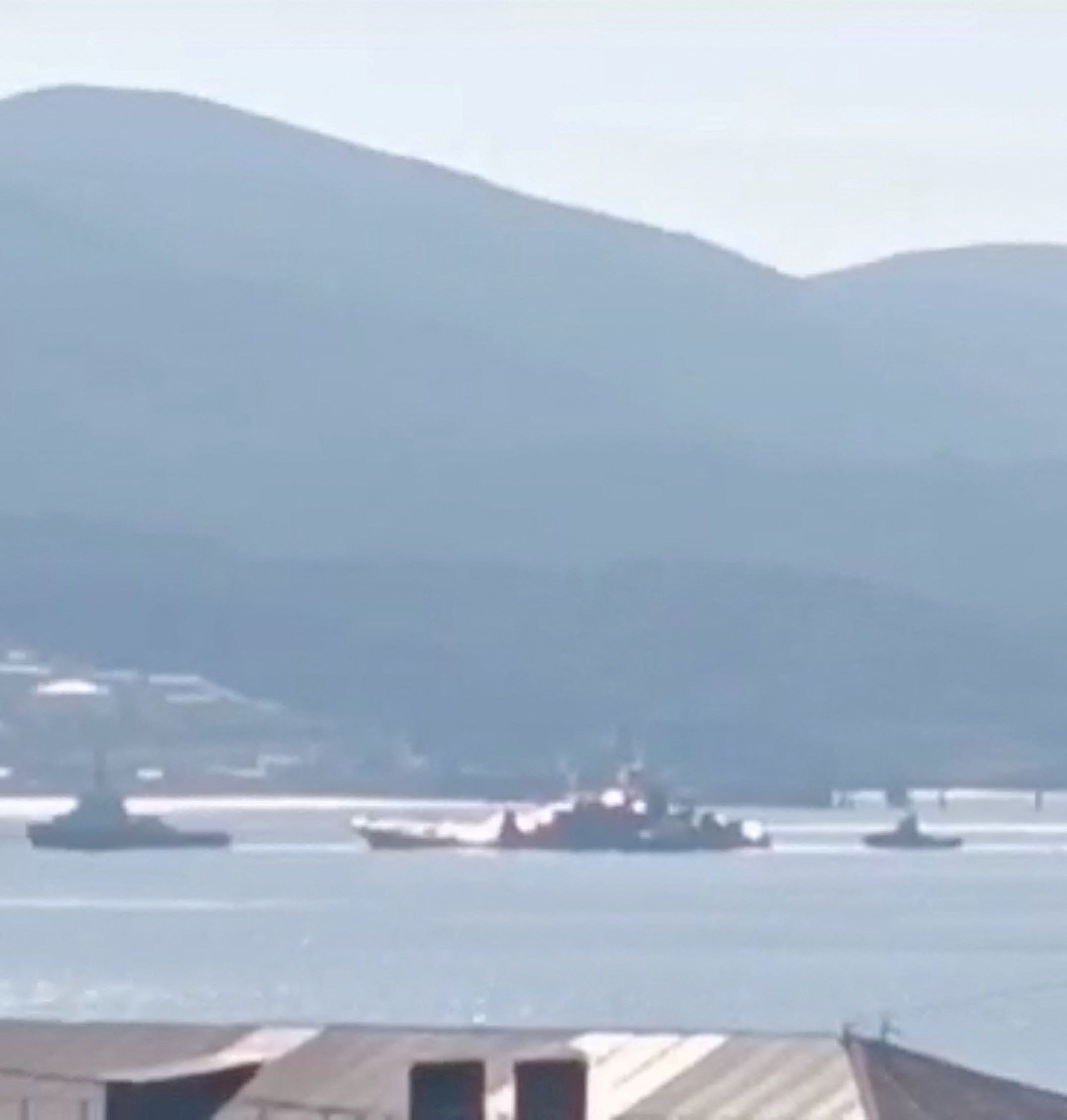 Olenegorsky Gornyak, a Russian Navy landing ship, gets tugged to shore, after being damaged in a Ukrainian attack, off Novorossiysk, Russia