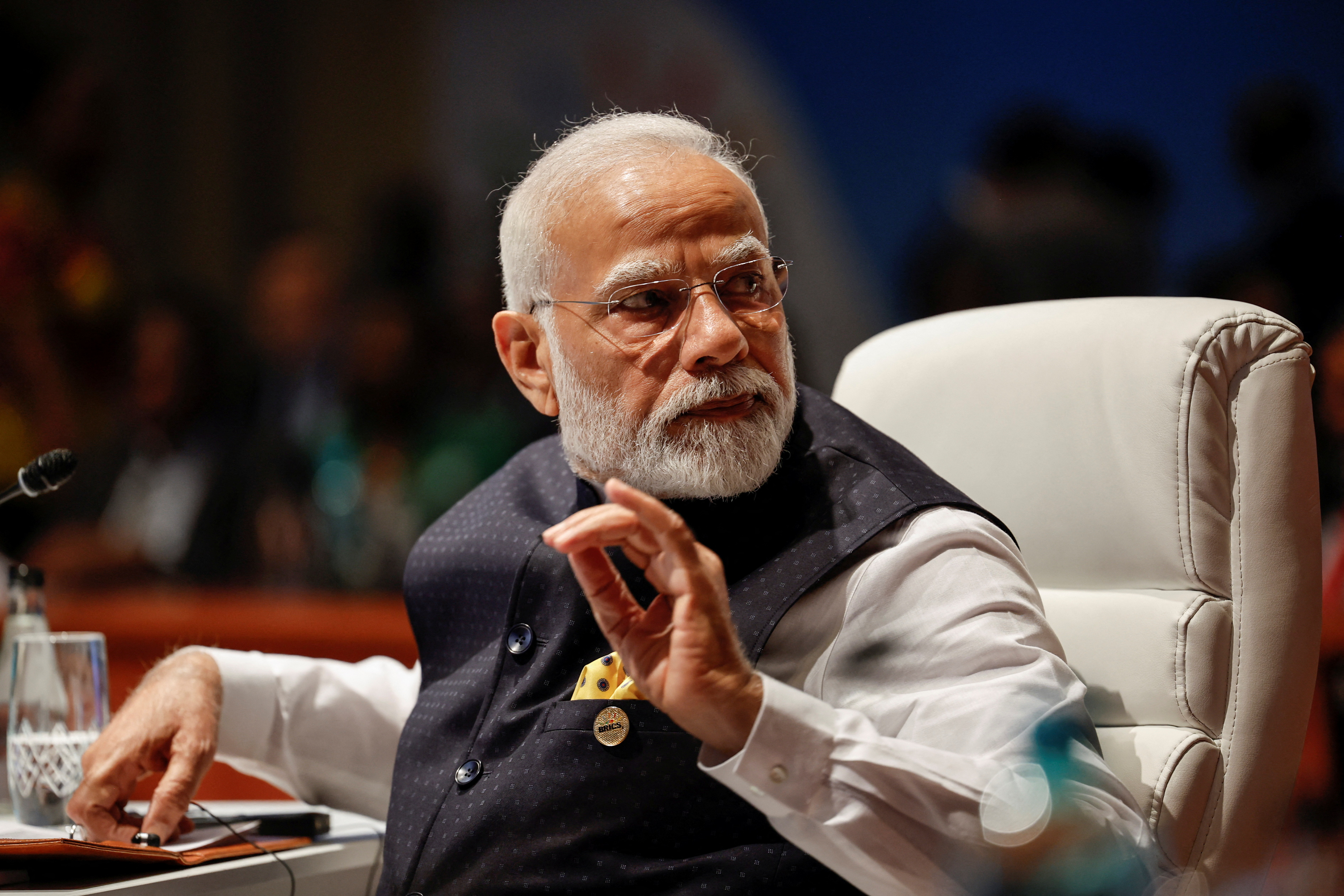 Indian Prime Minister Narendra Modi's rise has led to a surge in online disinformation spread by far-right accounts in the country. Now they are bringing that skillset to the Israel-Gaza war [Gianluigi Guercia/Pool via Reuters]