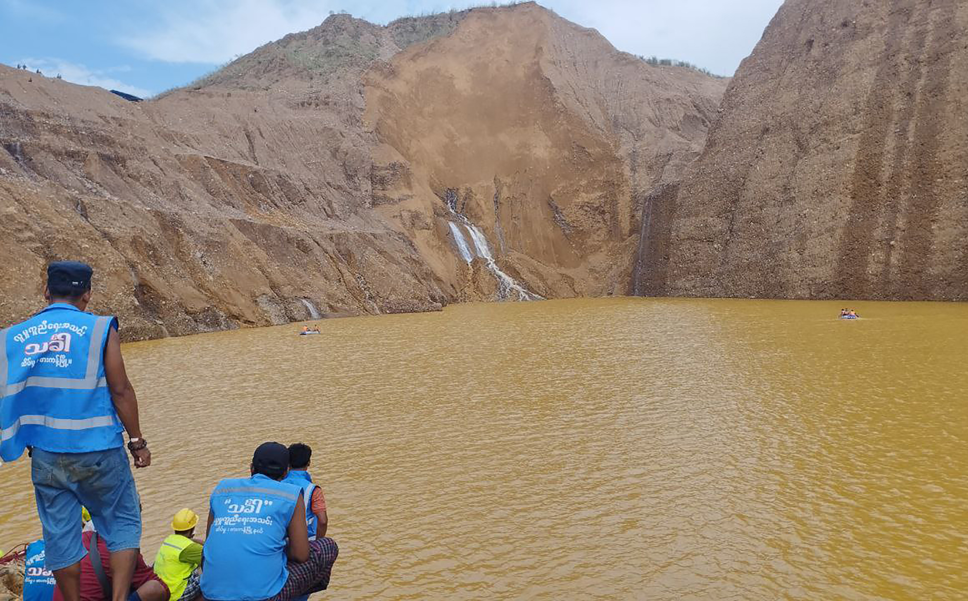 Rescue workers at the site of a deadly landslide in Myanmar