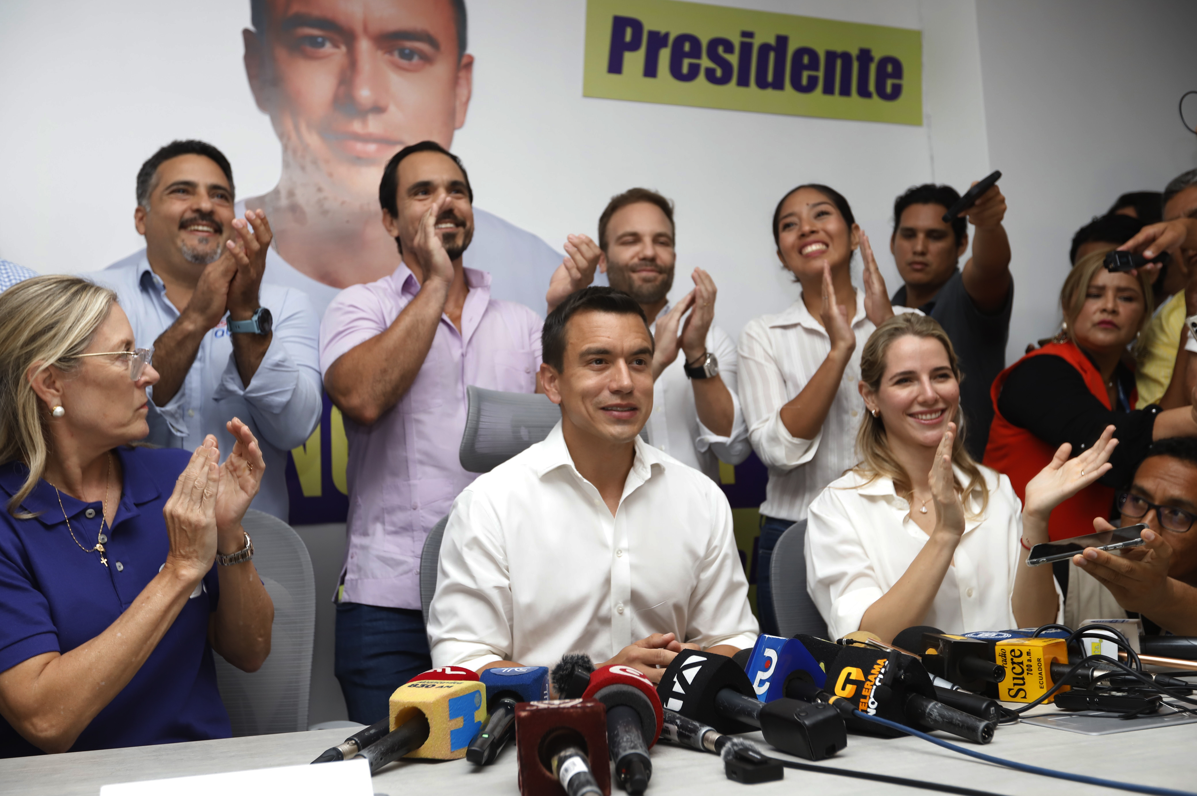 Daniel Noboa, centre, his wife Lavinia Valbonesi and his team celebrate during a press conference in Guayaquil, Ecuador [AP Photo]