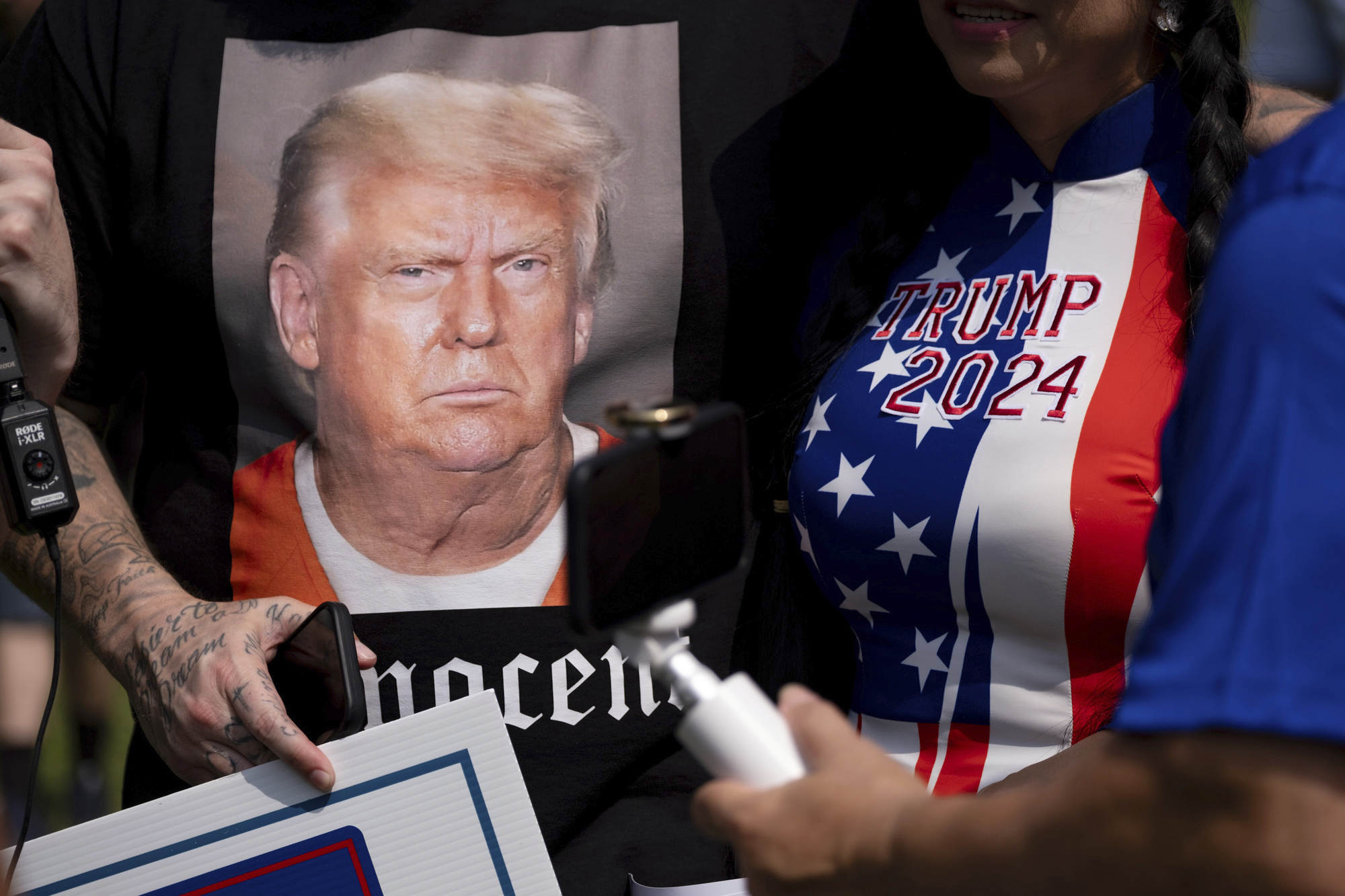 Dozens of Donald Trump supporters gather outside the Fulton County jail, along with media members and counterprotesters
