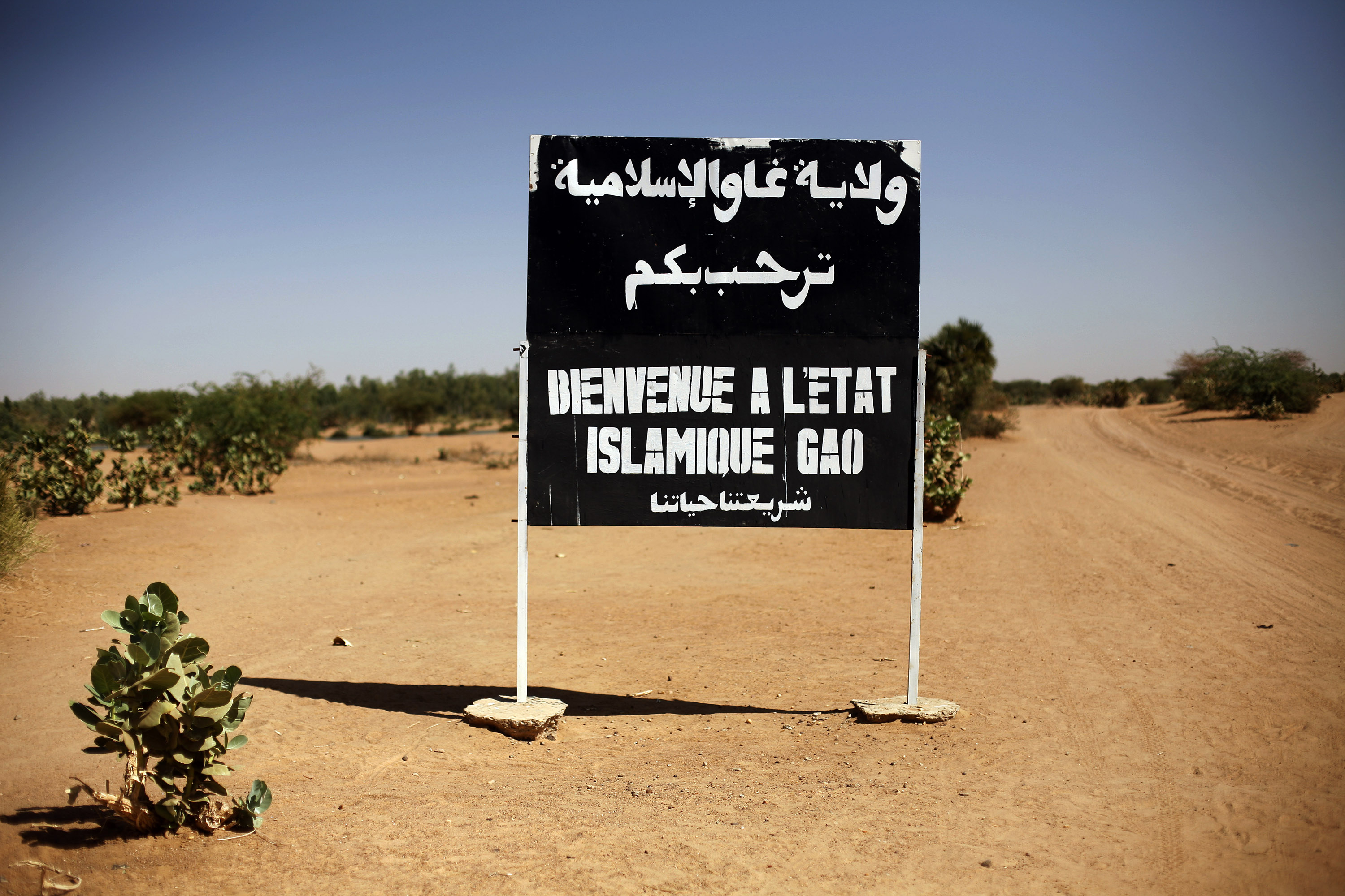 A sign on the northern road exiting in Gao, Northern Mali, reads "welcome to the islamic state of Gao on Jan. 30, 2013.