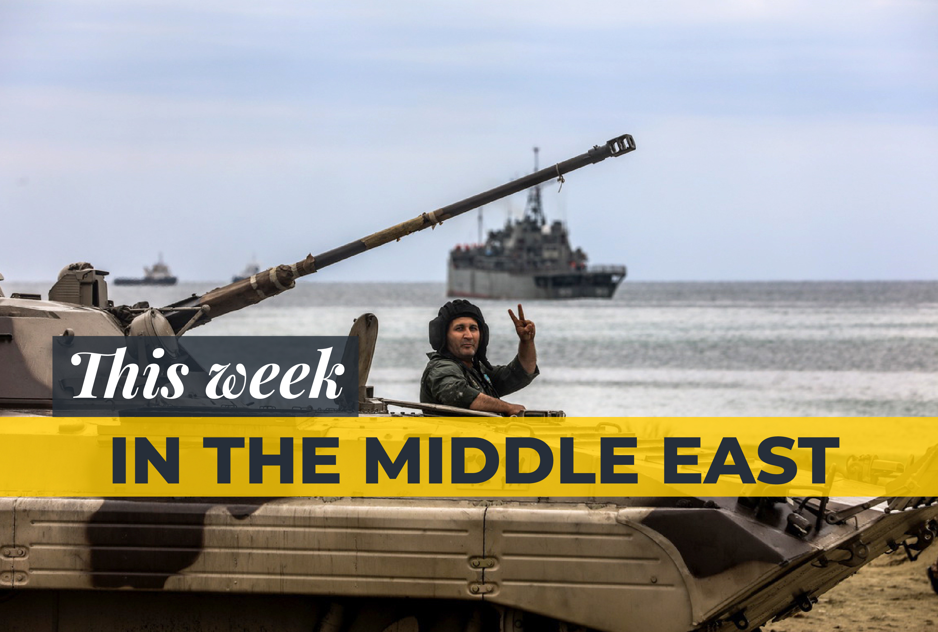 A handout picture provided by the Iranian Army office on December 30, 2022 shows an Iranian soldier flashing the victory sign during a military drill in Makran beach on the Gulf of Oman, near the Hormuz Strait.