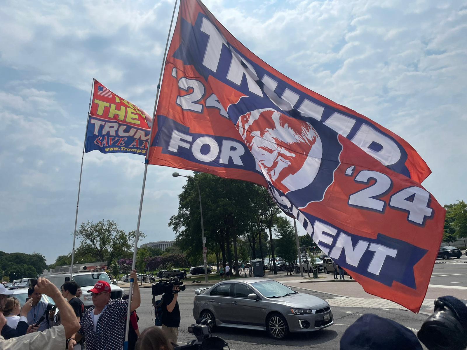 Trump supporter Dion Cini holds a ‘Trump for President’ flag in Washington, DC