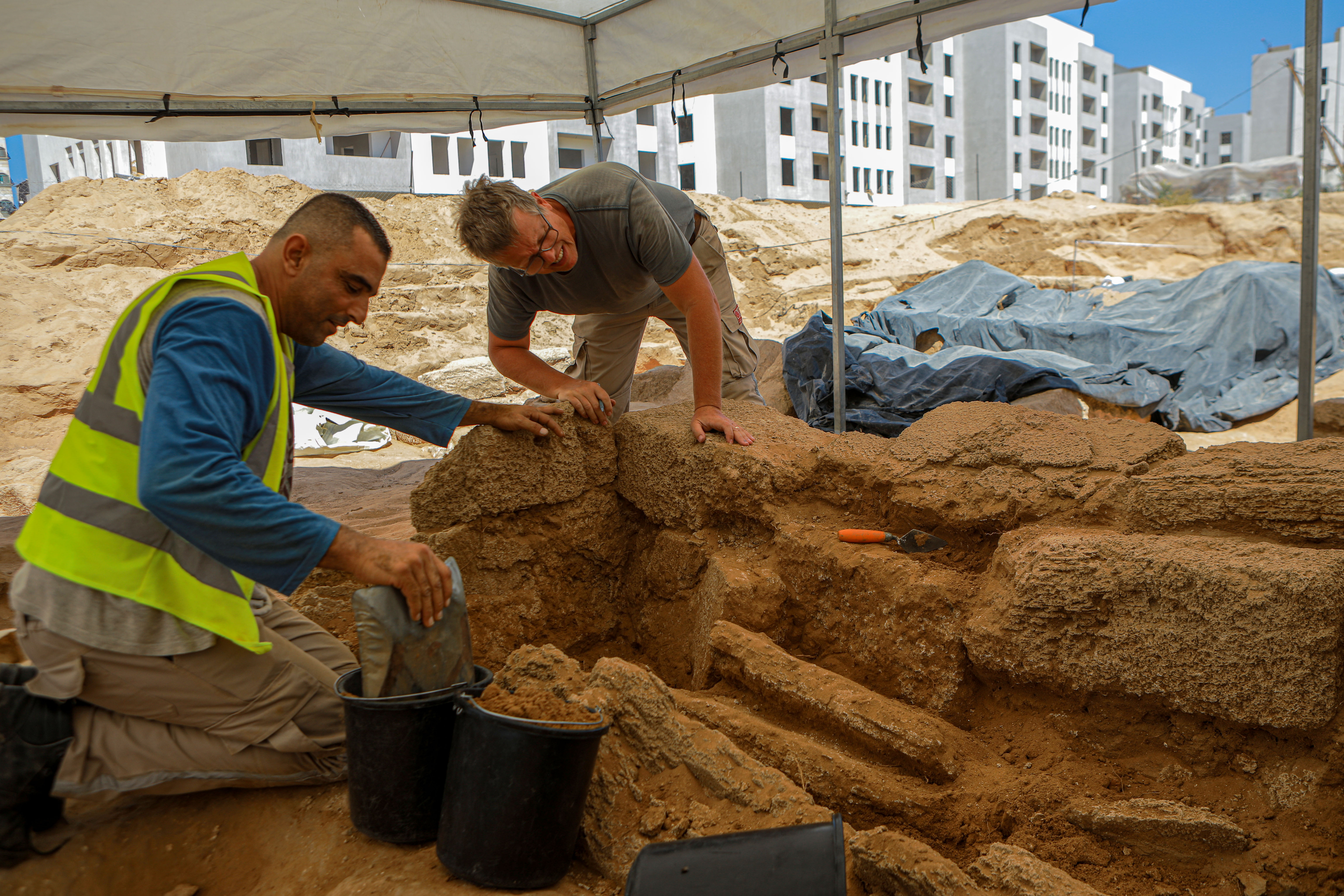 A French mission expert works with the excavation team at the Roman cemetery site northwest of Gaza
