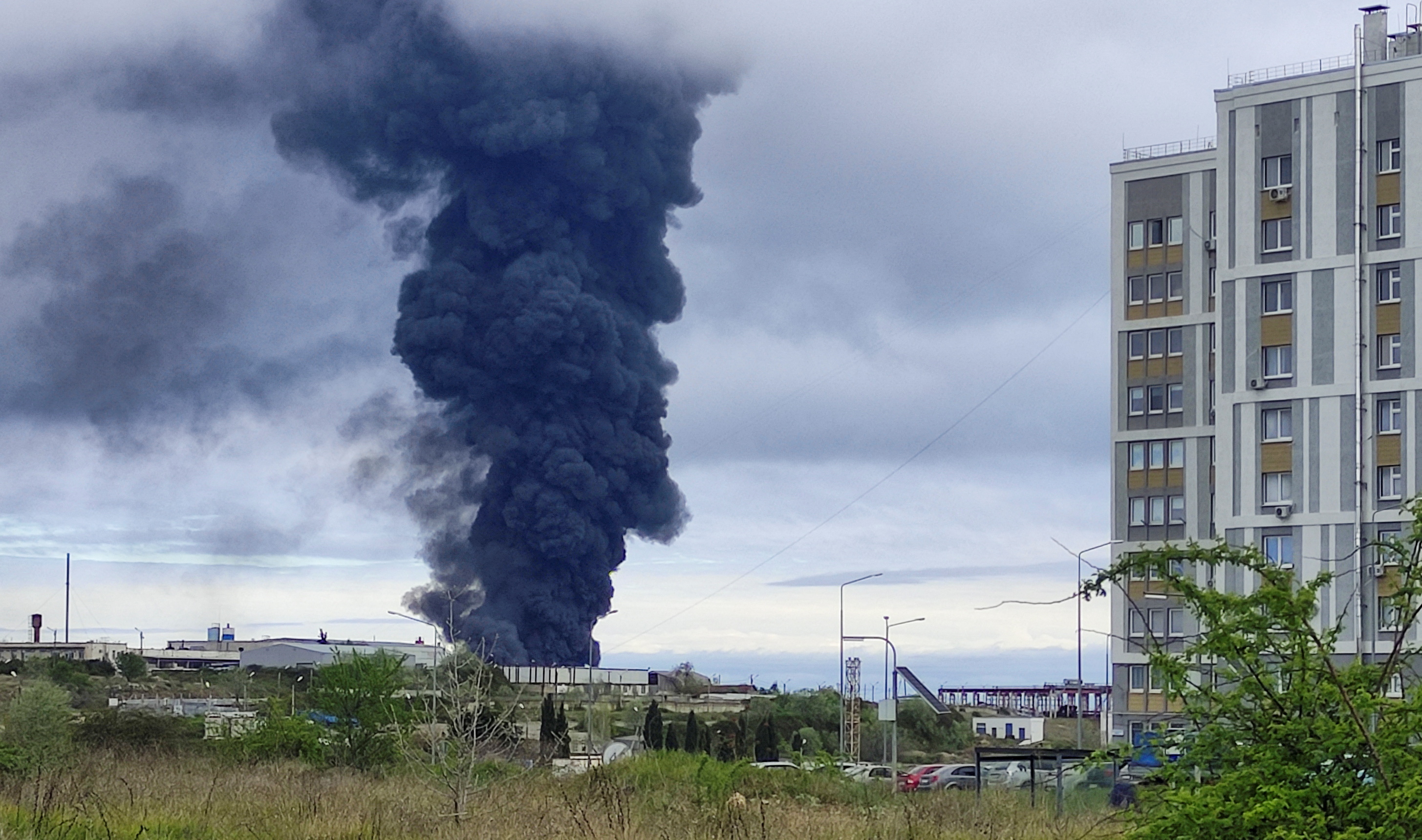 Smoke rises over a fuel tank following an alleged drone attack in Sevastopol, Crimea, April 2023