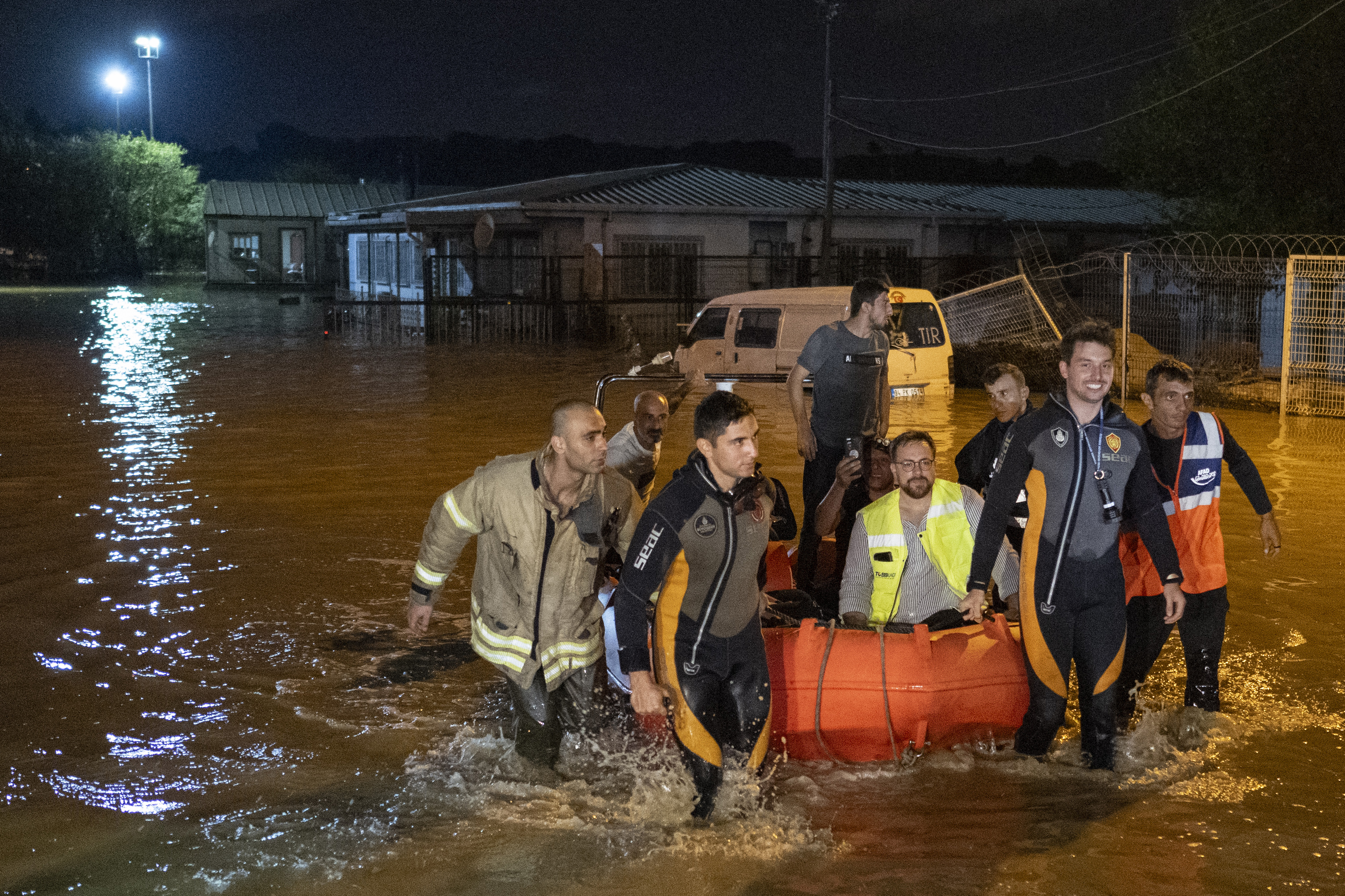 People are evacuated by boat in the Kucukcekmece district in Istanbul