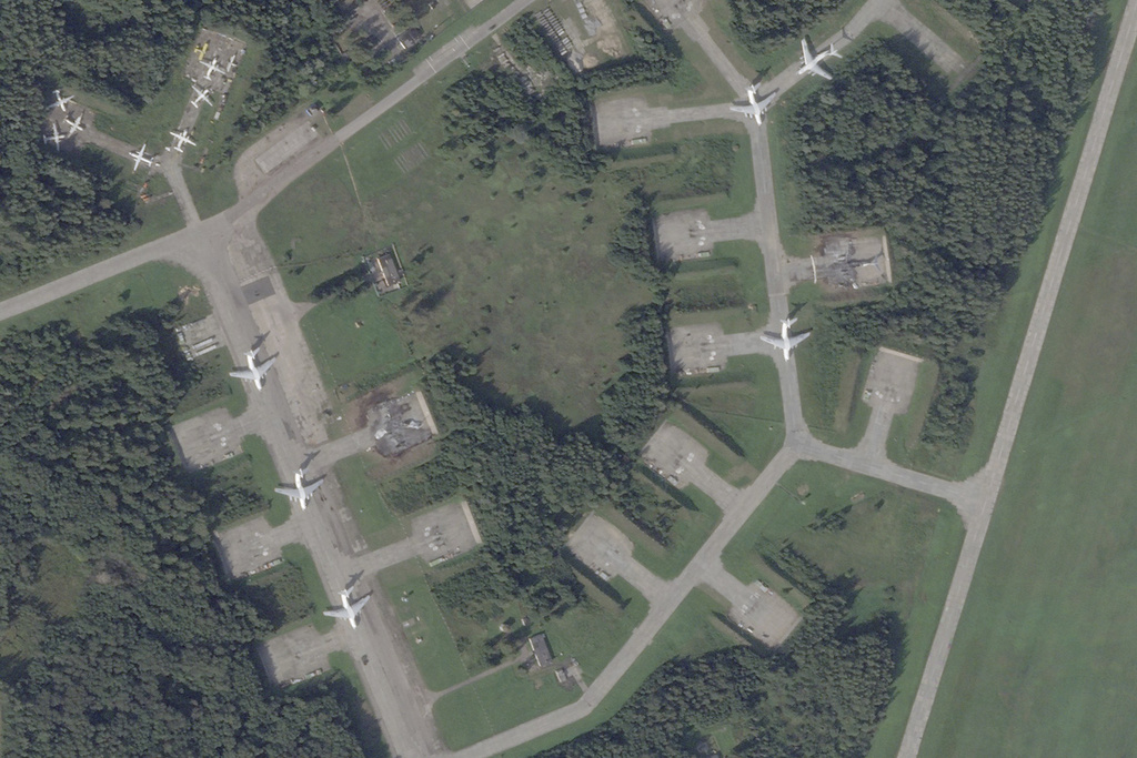 This satellite photo from Planet Labs PBC shows the dual military-civilian use Princess Olga Pskov International Airport in Pskov, Russia, Thursday, Aug. 31, 2023. Satellite images analyzed by The Associated Press show that suspected Ukrainian drone attacks destroyed at least two Ilyushin Il-76 military transport planes at the Russian air base. (Planet Labs PBC via AP)