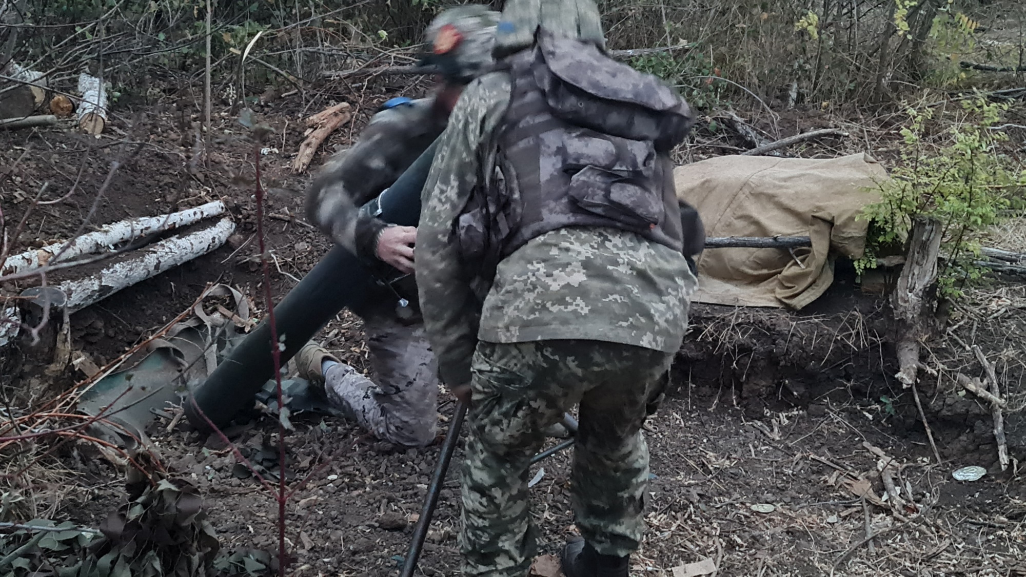A photo of two soldiers holding something.