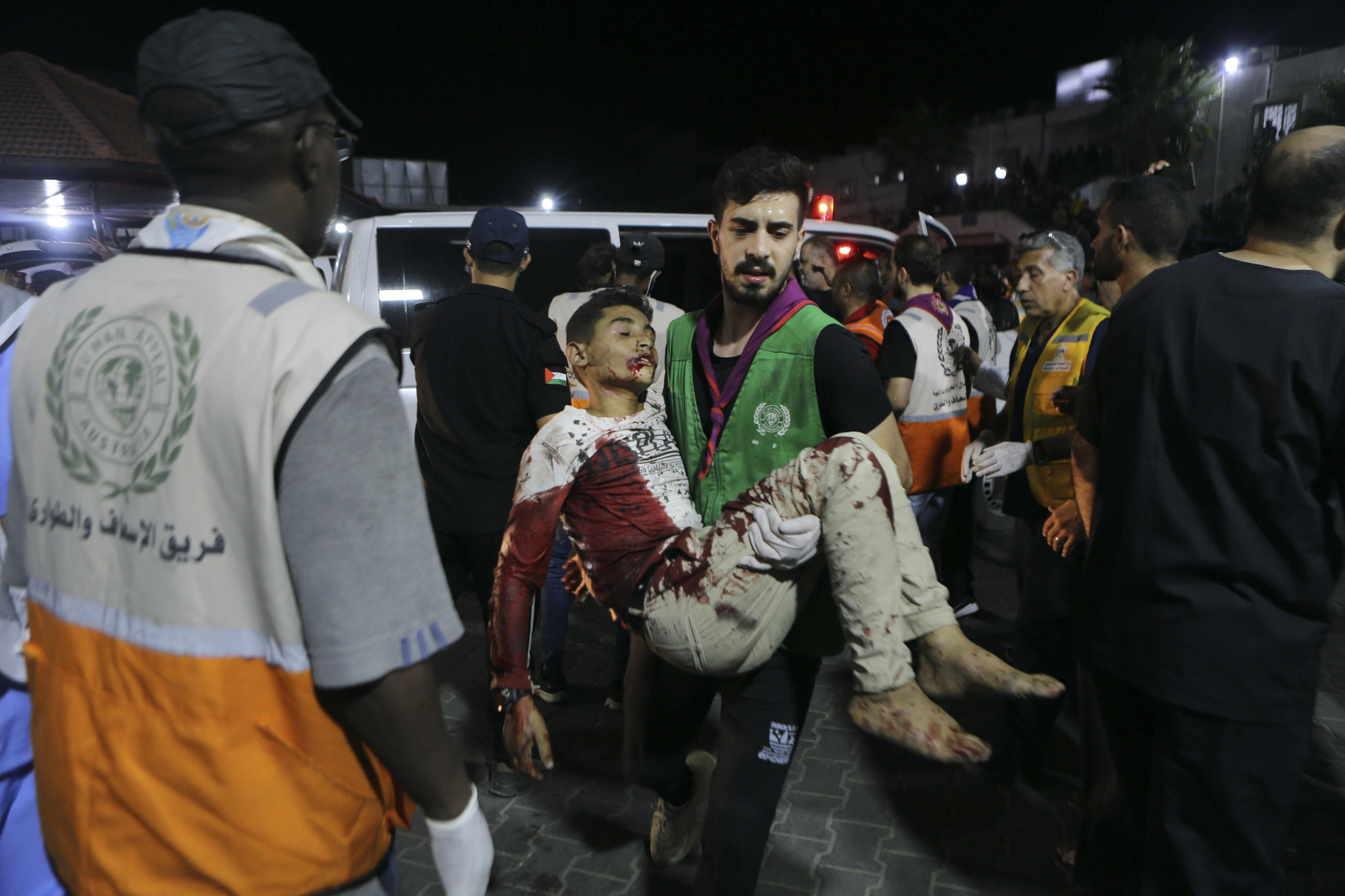 Wounded Palestinians arrive at the al-Shifa hospital following Israeli airstrikes