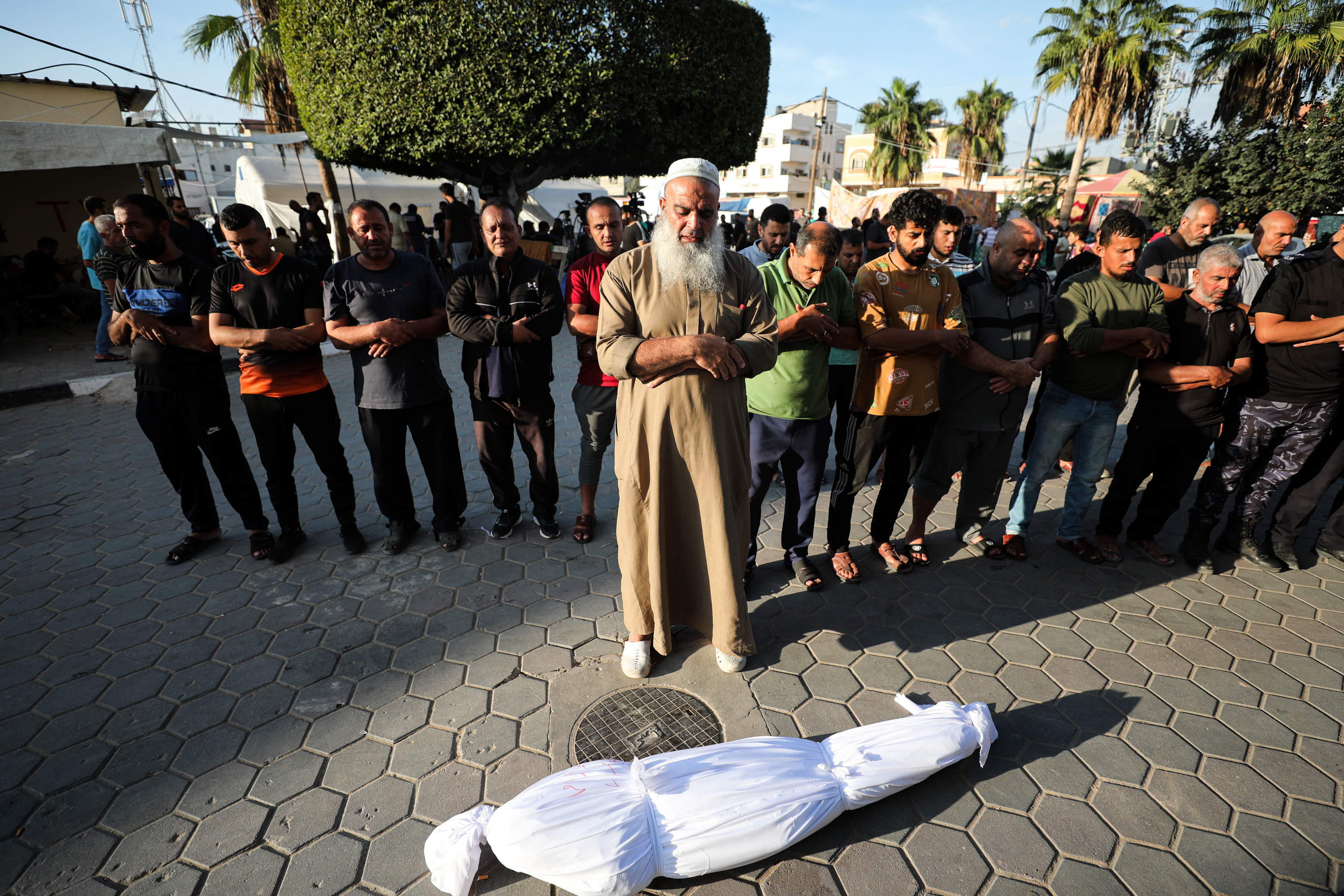 Since the war began more than a month ago, Abu Saher al-Maghari has had to shroud up to 200 bodies every day