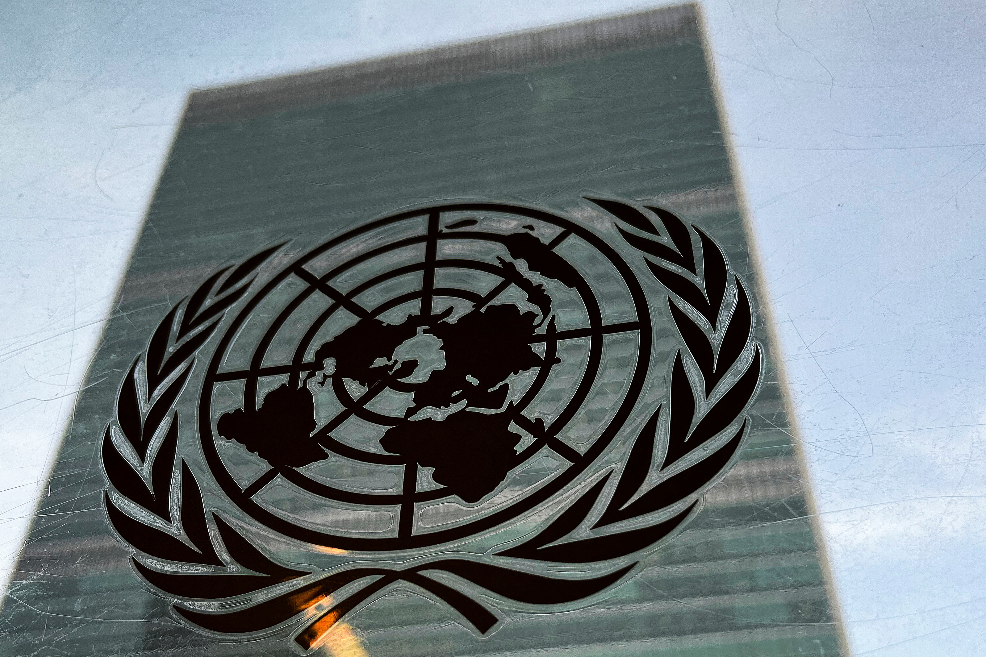 The United Nations headquarters building is pictured with a UN logo.