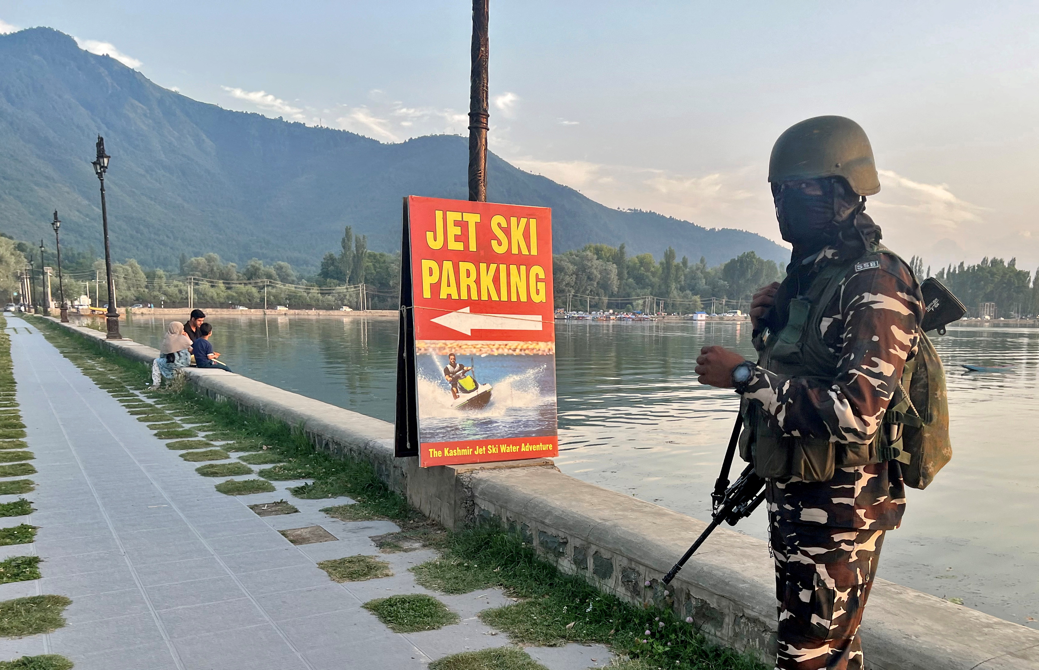 An Indian security force personnel stands guard on the banks of Dal Lake, one of Kashmir's main tourist attractions, in Srinagar, India July 6, 2023. REUTERS/Altaf Hussain