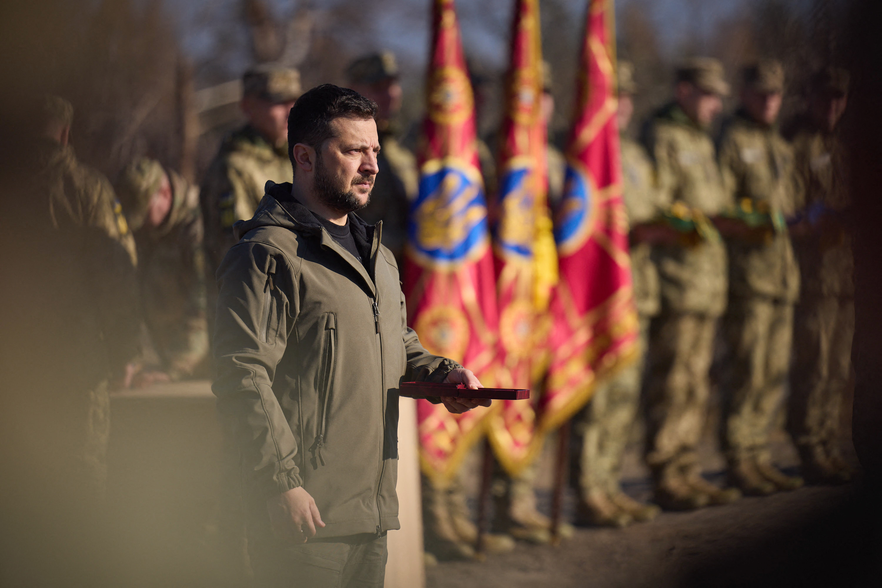 Ukrainian President Volodymyr Zelenskyy, pictured presenting military awards, is considering whether to proceed with next year’s election [Ukrainian Presidential Press Service via AFP]