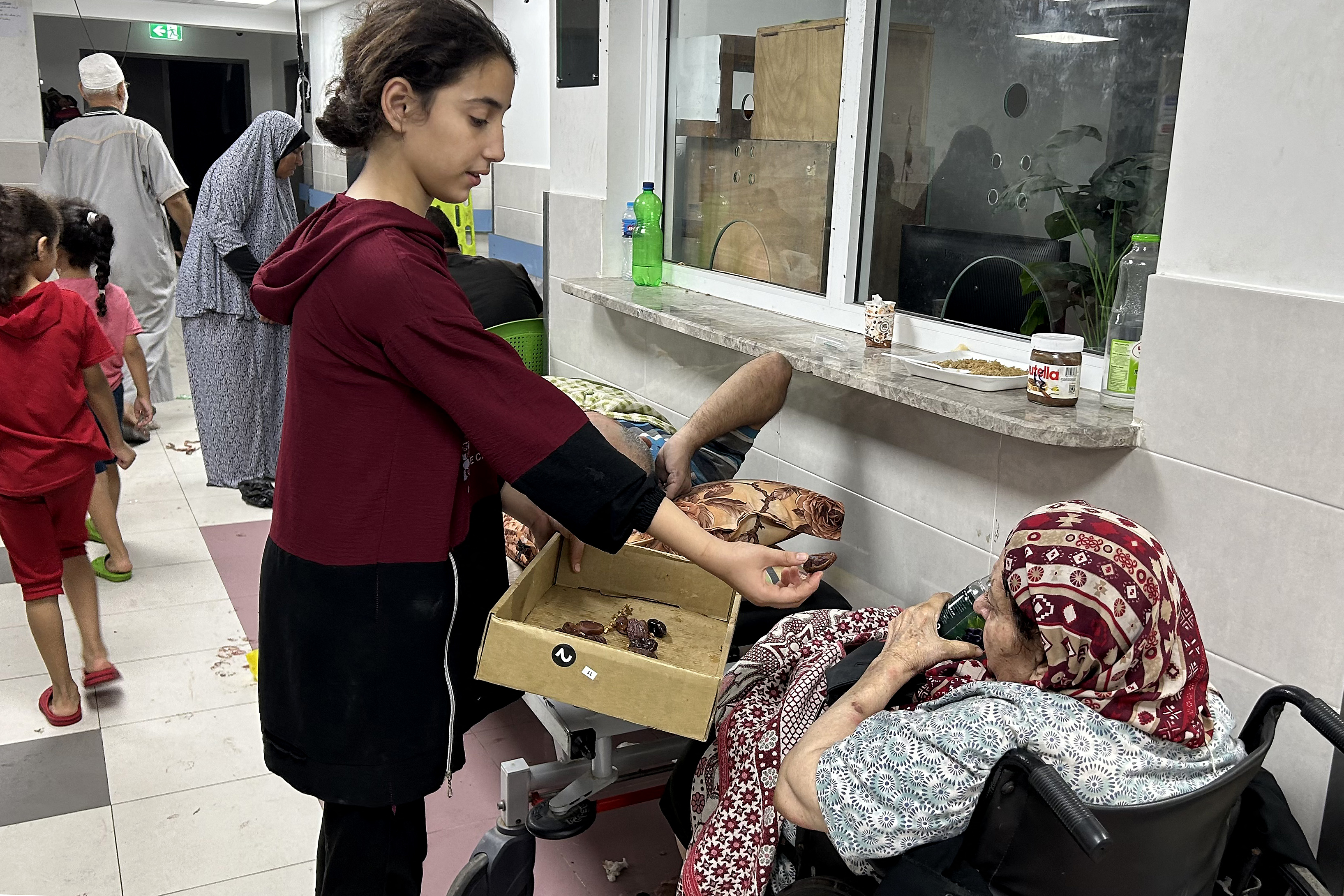 Patients and internally displaced people are pictured at Al-Shifa hospital in Gaza City on November 10