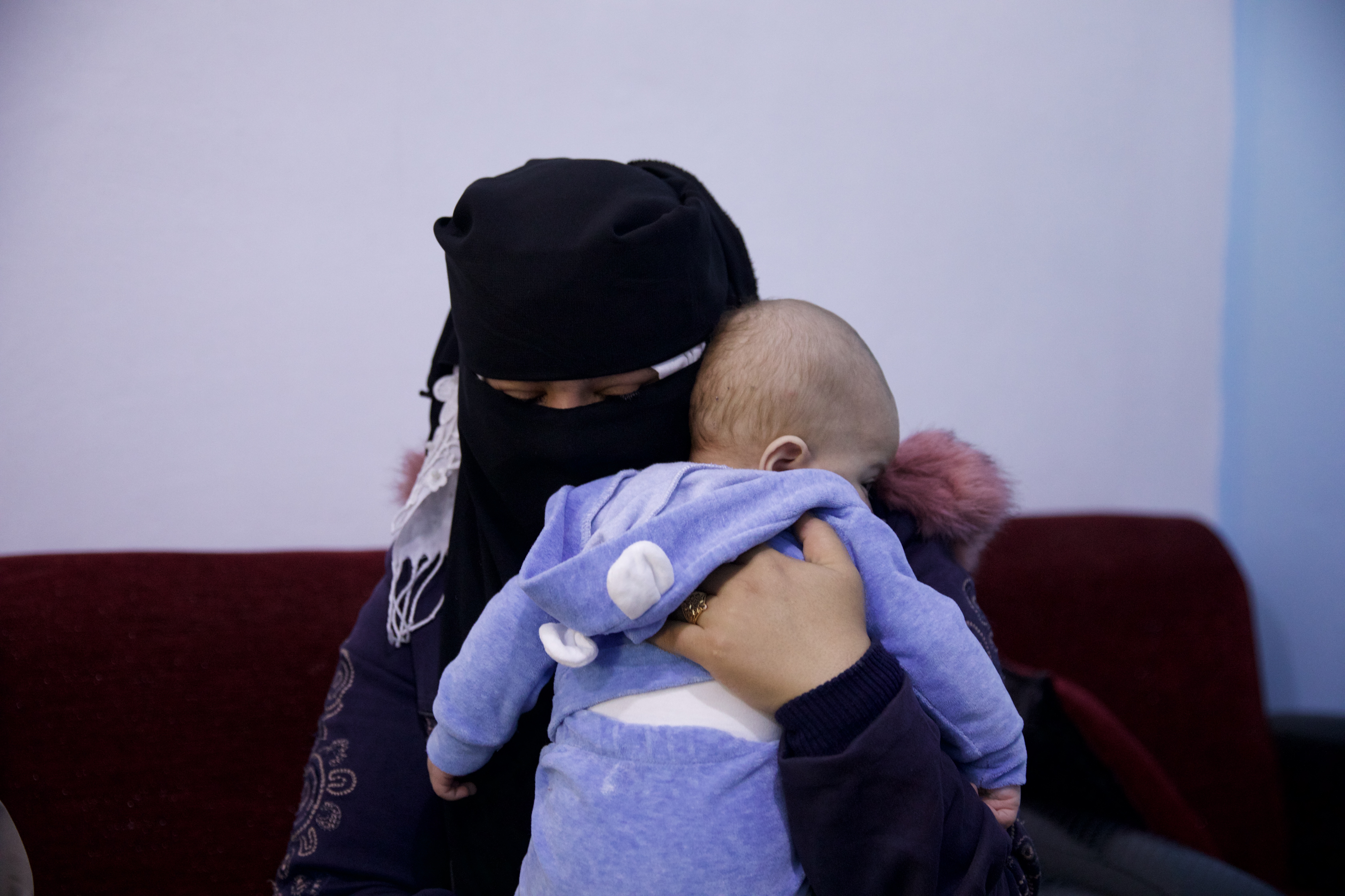 Khawla holds Ahmed at Child Houses. ‘He will be my soul and beating heart, she said