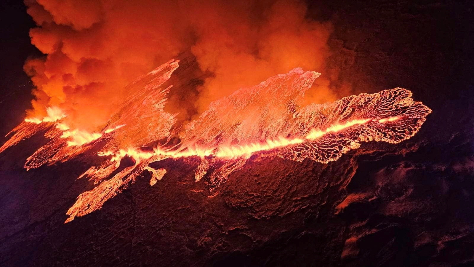A volcano spews lava and smoke as it erupts in Grindavik, Iceland