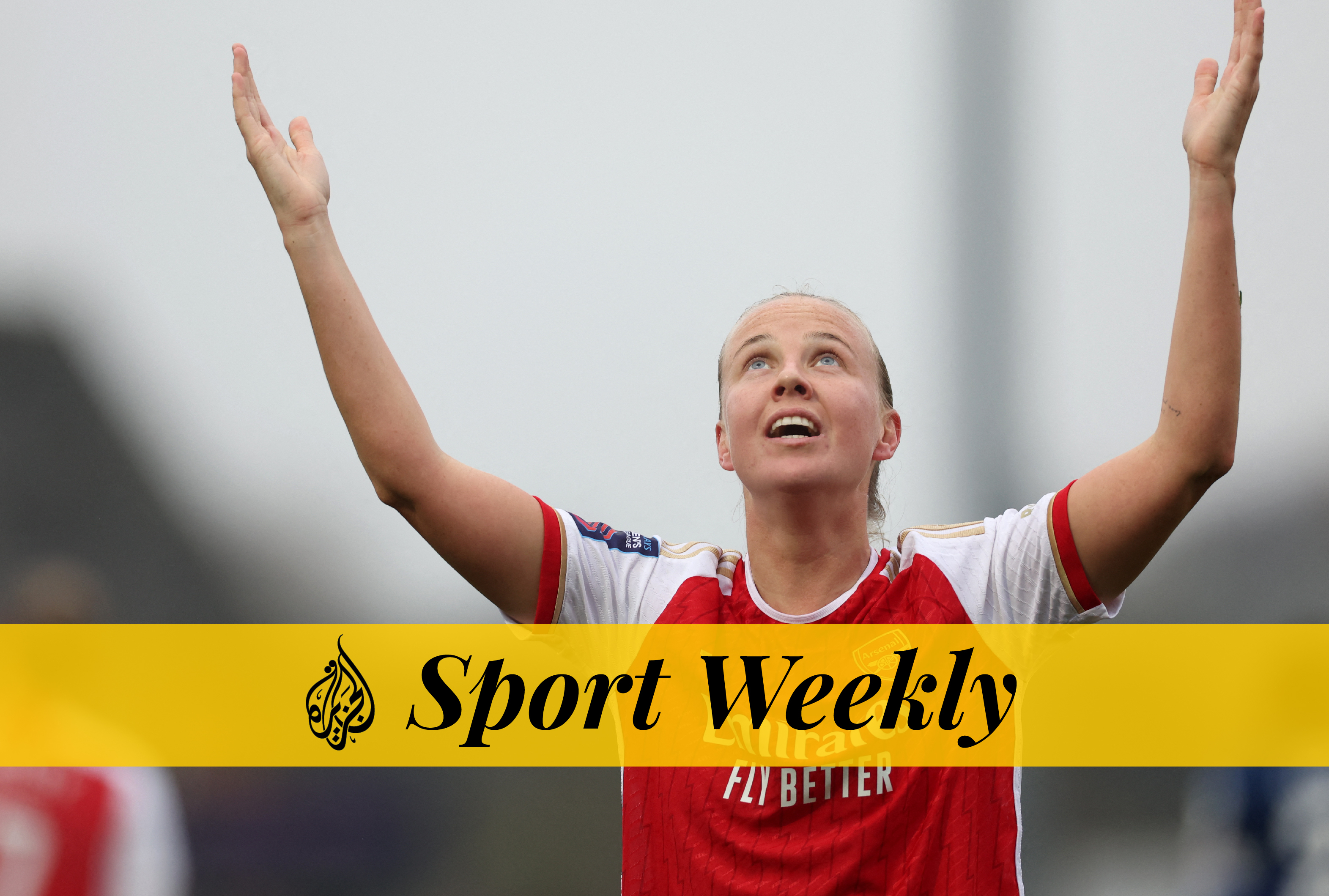 Arsenal's Beth Mead celebrates scoring with her arms aloft as she looks to the sky