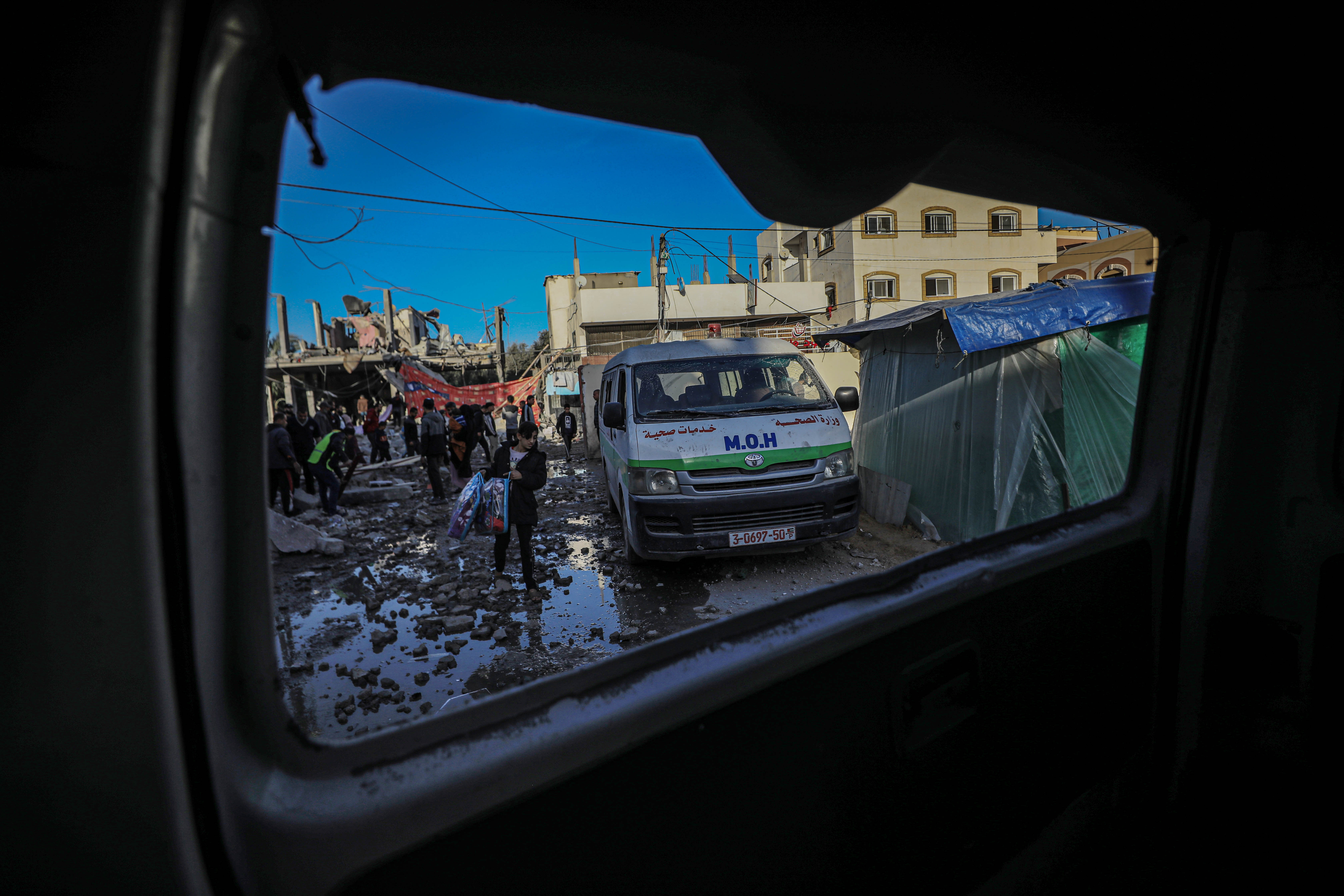 In the middle of families trying to flee, a home near the hospital was bombed by Israel, killing people and spreading more terror