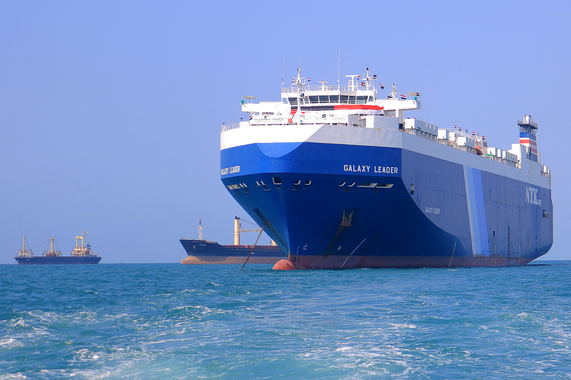 a blue ship with the name galaxy leader written on it