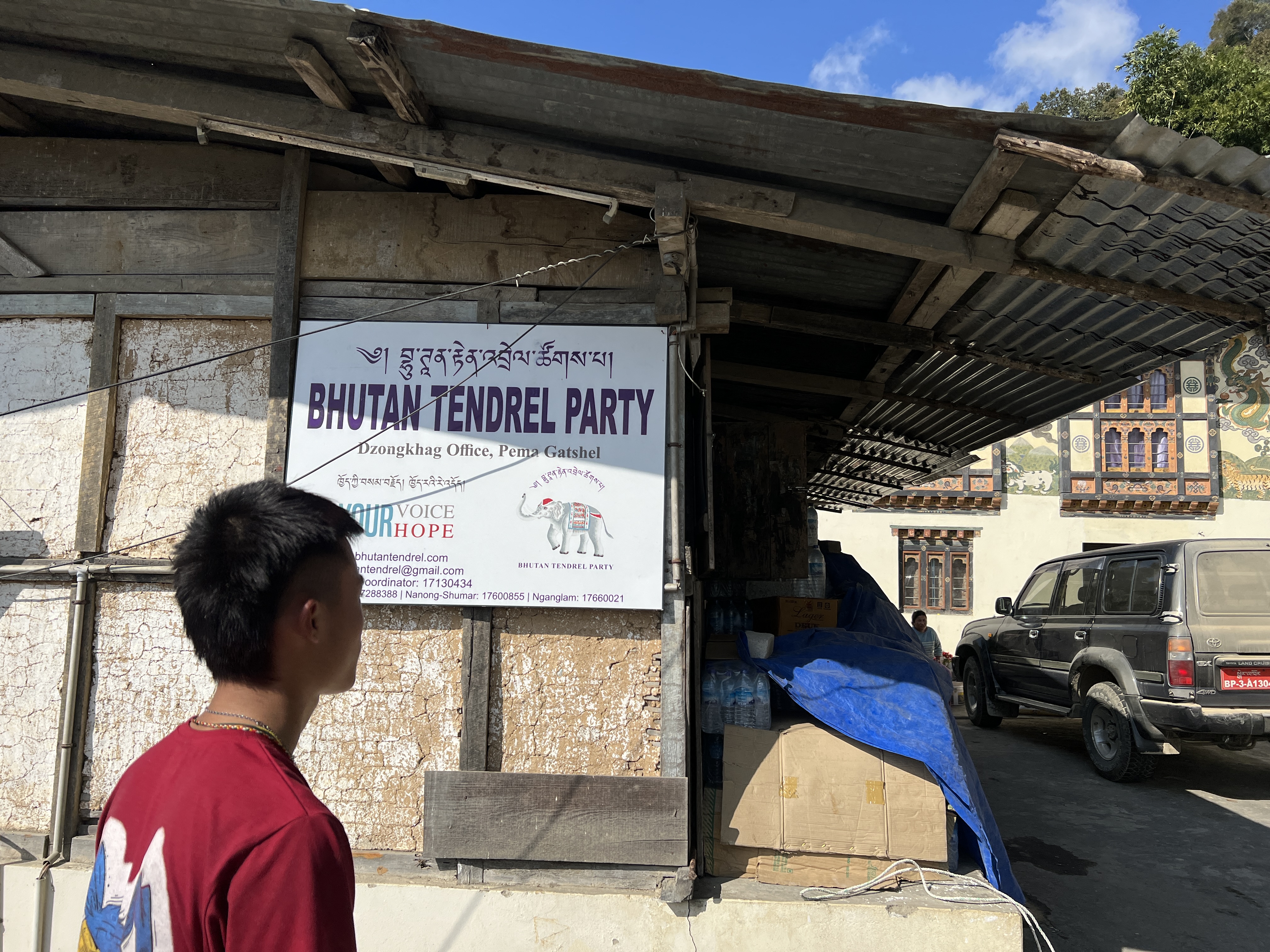 A man reads a party poster ahead of the parliamentary election in Pemagatshel, Bhutan